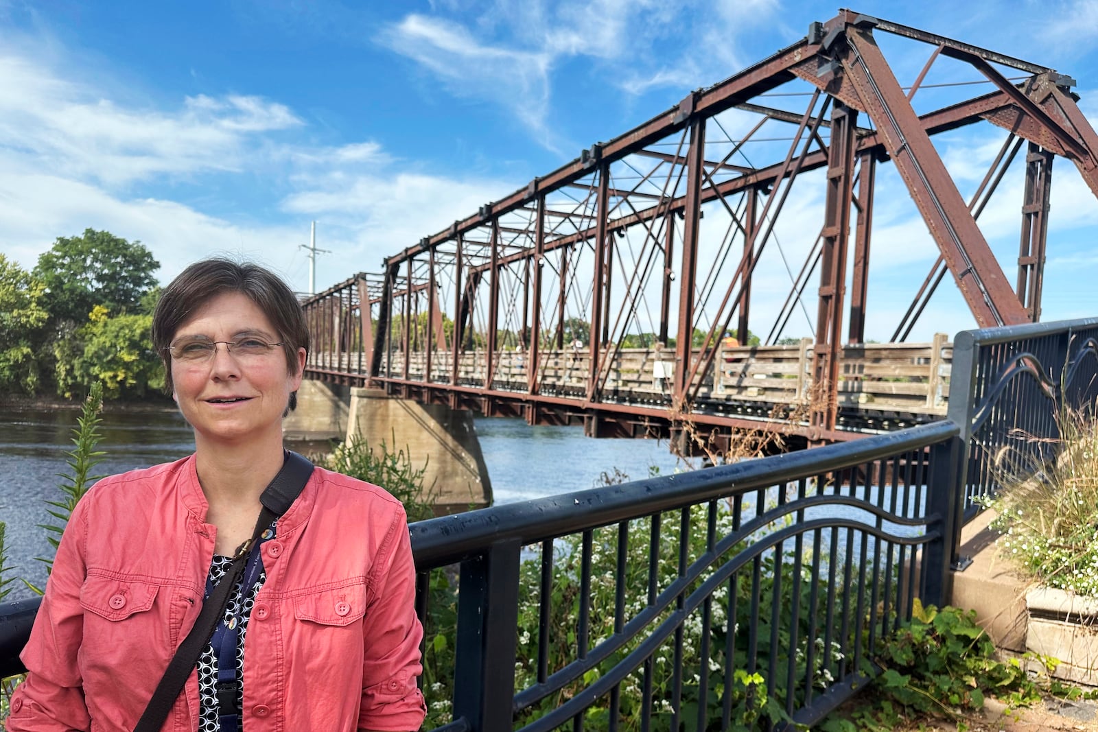 Stephanie Hirsch, city manager for Eau Claire, Wis., who supported the resettlement of refugees in the western Wisconsin city despite opposition from Republicans, poses in a downtown park ahead of a campaign visit from vice presidential candidate JD Vance Tuesday, Sept. 17, 2024. (AP Photo/Scott Bauer)