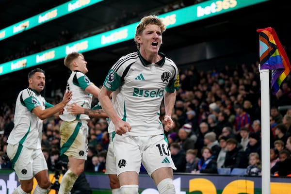 Newcastle United's Anthony Gordon celebrates after Crystal Palace's Marc Guehi scored an own goal during the English Premier League soccer match between Crystal Palace and Newcastle United at Selhurst Park, London, Saturday Nov. 30, 2024. (Ben Whitley/PA via AP)