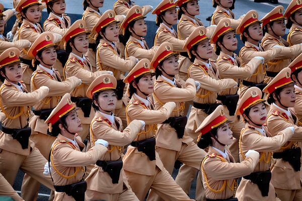 Vietnamese female police officers march during a parade celebrating the 50th anniversary of the end of the Vietnam War on Wednesday, April 30, 2025, in Ho Chi Minh City, Vietnam. (AP Photo/Richard Vogel)
