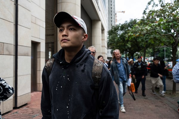 Lee Yue-shun, former pro-democracy district councilor who was cleared of the charge of the national security case, leaves the West Kowloon Magistrates' Courts in Hong Kong Tuesday, Nov. 19, 2024, following the sentencing in national security case. (AP Photo/Chan Long Hei)