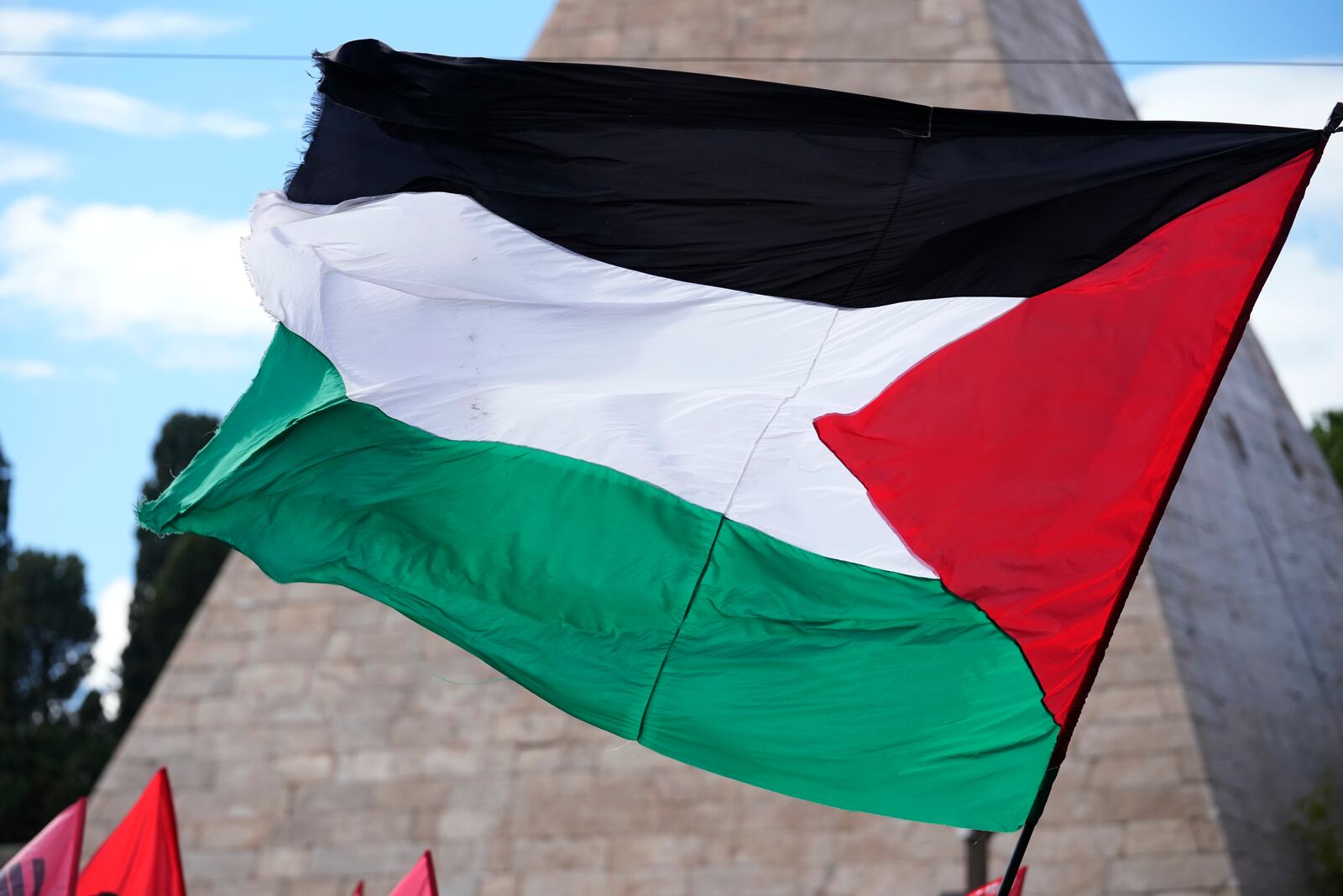 Palestinian flag is seen during a protest in Rome, Saturday, Oct. 5, 2024. Pro-palestinians people take to the street in an unauthorised march in the centre of Rome two days ahead of the first anniversary of the Oct. 7. (AP Photo/Andrew Medichini)