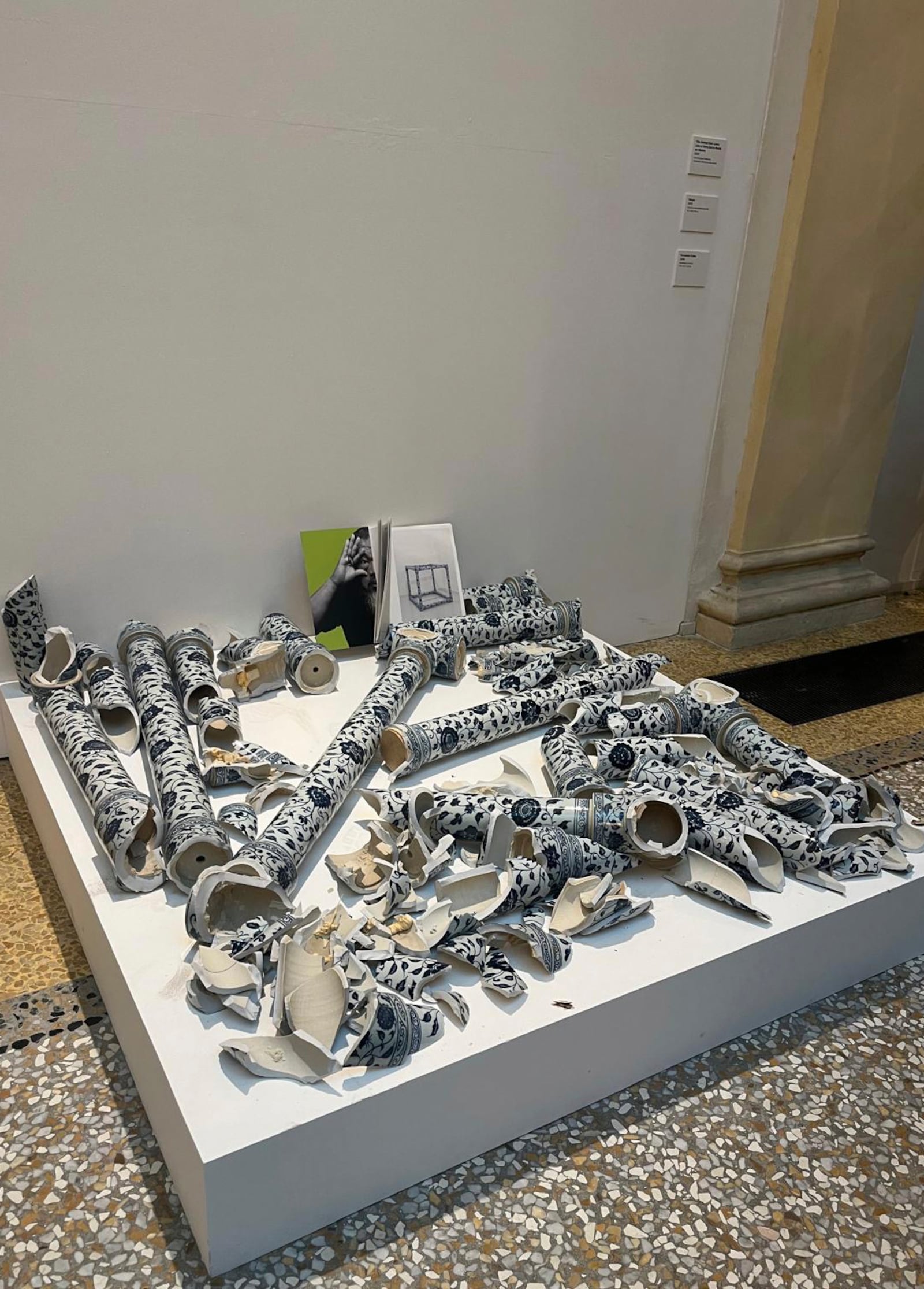 This photo released by OperaLaboratori Tuesday, Sept. 24, 2024 shows the artwork Porcelain Cube by artist Ai Wei Wei destroyed by a Czech man on the day of the opening of the exhibition 'Ai Weiwei, Who am I?", at Palazzo Fava in Bologna, Italy, Friday, Sept. 20, 2024. (OperaLaboratori via AP)