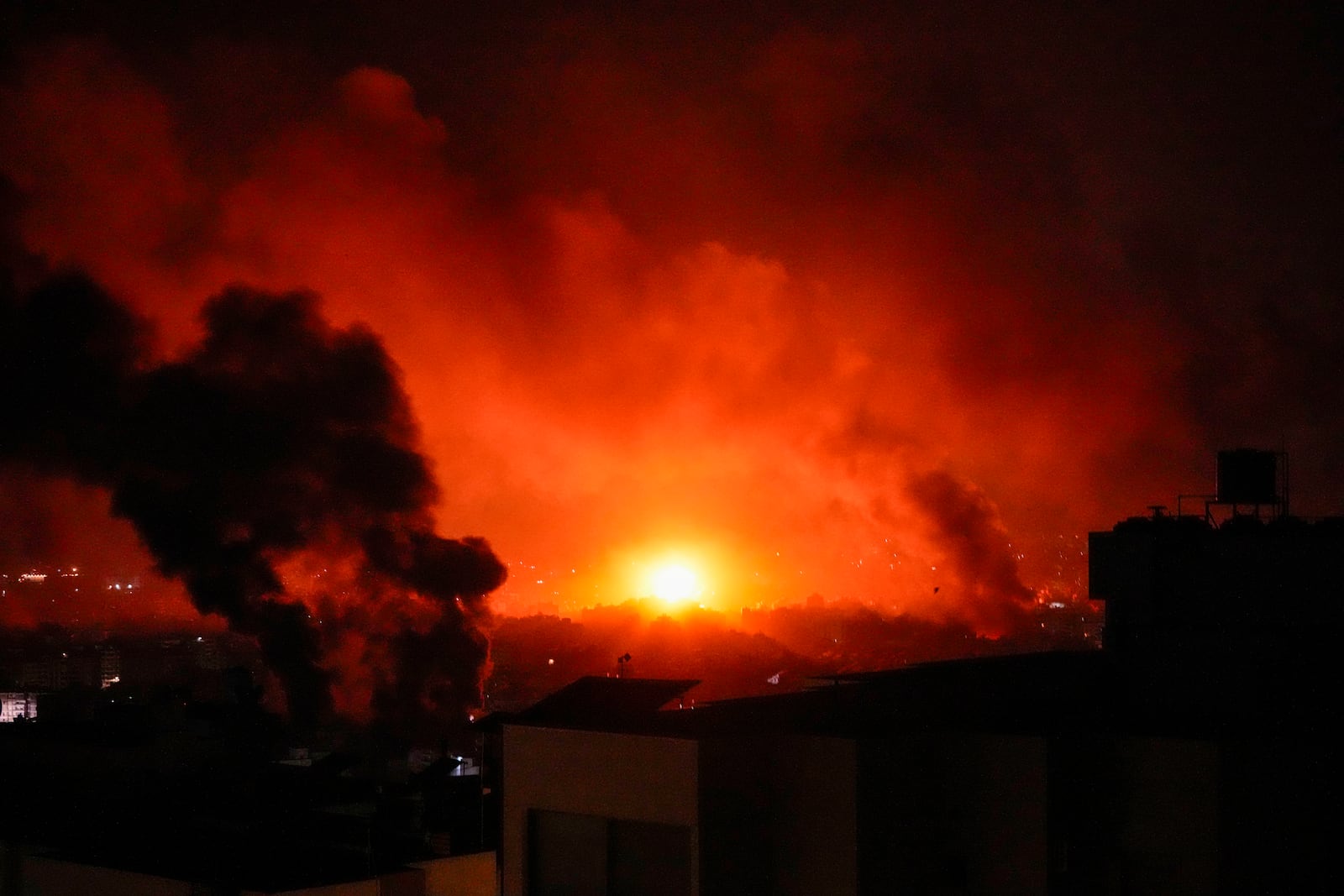 Smoke and fire rise following an Israeli airstrikes in Beirut's southern suburbs, Lebanon, Saturday, Sept. 28, 2024. (AP Photo/Hassan Ammar)