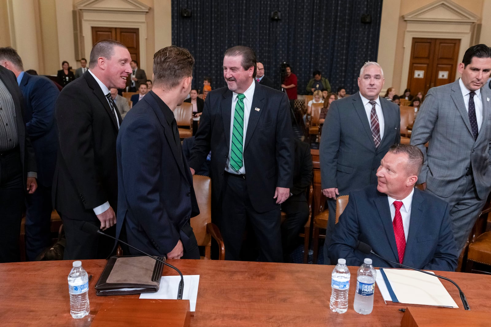 From left, Sgt. Edward Lenz, Commander of Butler County Emergency Services Unit, Patrolman Drew Blasko of Butler Township Police Department, former U.S. Secret Service agent Patrick Sullivan, and Lt. John Herold of Pennsylvania State Police, arrive to testify at the first public hearing of a bipartisan congressional task force investigating the assassination attempts against Republican presidential nominee former President Donald Trump, at Capitol Hill in Washington, Thursday, Sept. 26, 2024. (AP Photo/Ben Curtis)