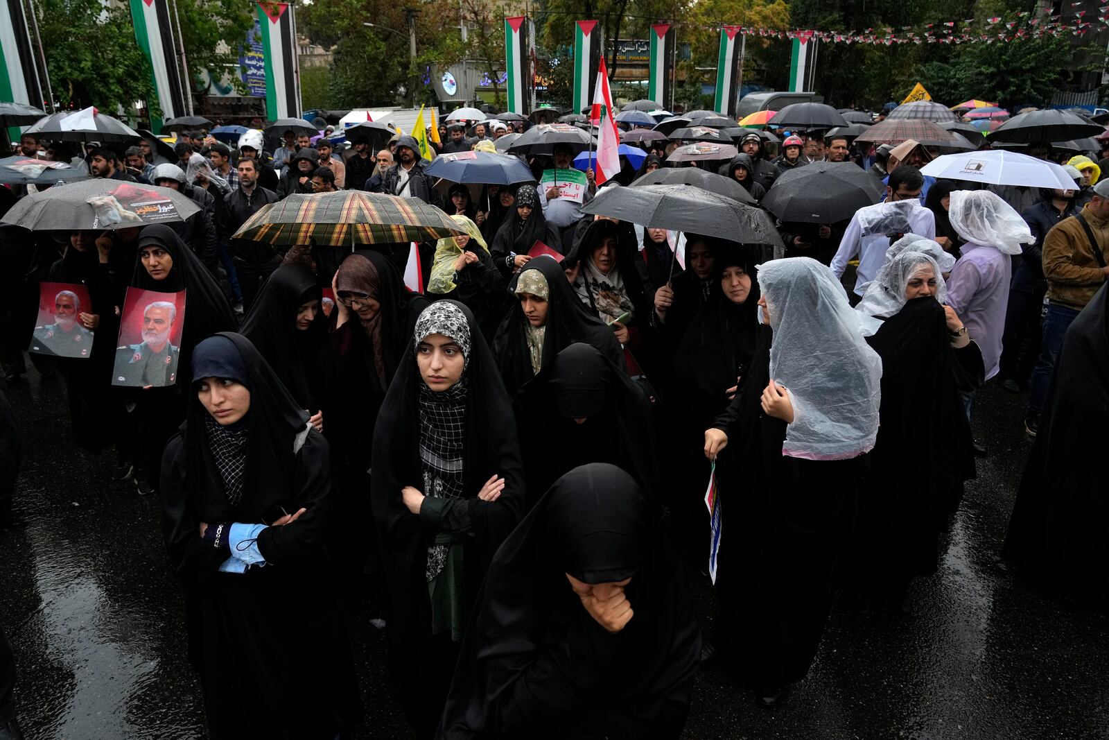 Iranian demonstrators attend a gathering to support Lebanon's militant Hezbollah group at the Felestin (Palestine) Sq. in downtown Tehran, Iran, Saturday, Sept. 28, 2024. (AP Photo/Vahid Salemi)