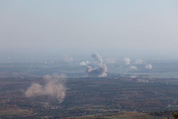 Smoke rises amid fighting between opposition factions and Syrian government troops in Dadikh, Aleppo countryside, Syria, Thursday, Nov. 28, 2024. (AP Photo/Ghaith Alsayed)