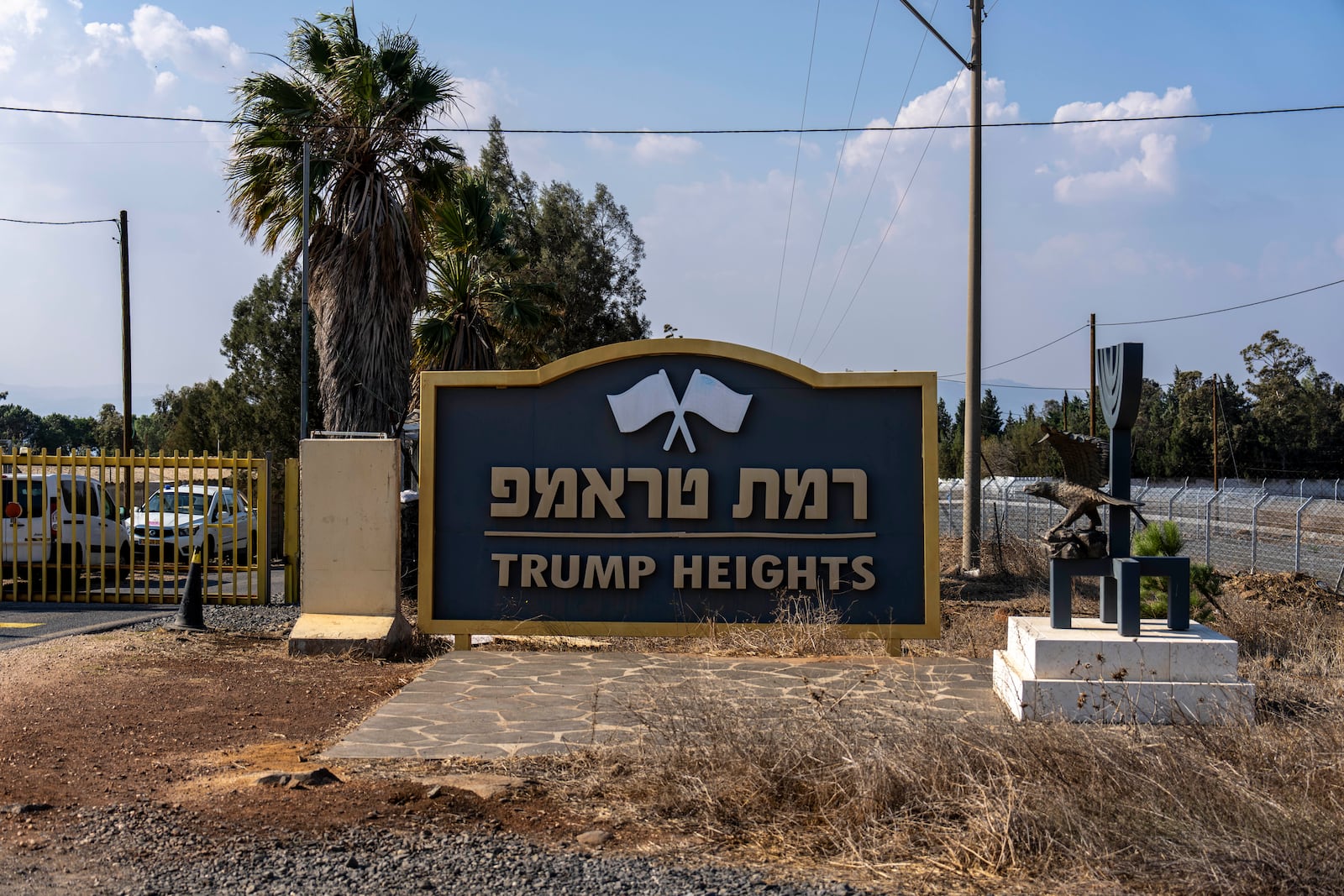 The entrance to the tiny settlement of "Trump Heights" in the Israeli-controlled Golan Heights, where the Israeli residents are welcoming the election of their namesake. They hope Donald Trump's return to the U.S. presidency will breathe new life into the community. Thursday, Nov. 7, 2024. (AP Photo/Ariel Schalit)