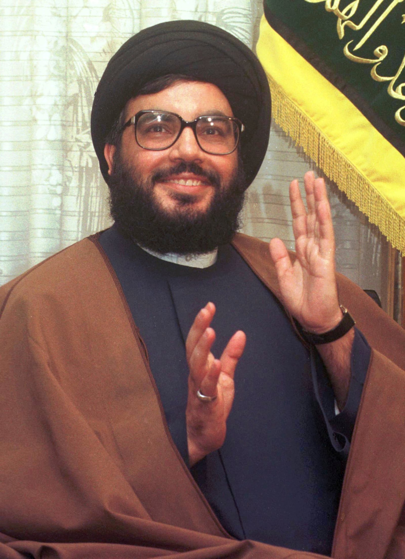 FILE - Hezbollah leader Hassan Nasrallah speaks to reporters in Beirut, Thursday, April 2, 1998. (AP Photo/Ali Mohamed, File)