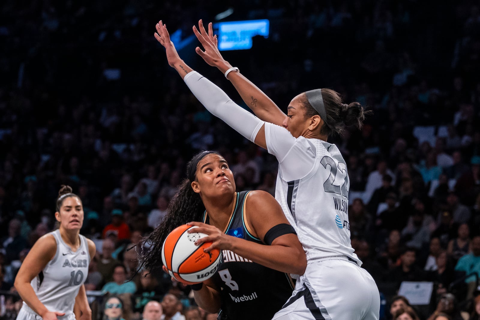 New York Liberty forward Nyara Sabally (8) is defended by Las Vegas Aces center A'ja Wilson (22) during the first half of a WNBA basketball second-round playoff game, Sunday, Sept. 29, 2024, in New York. (AP Photo/Corey Sipkin)