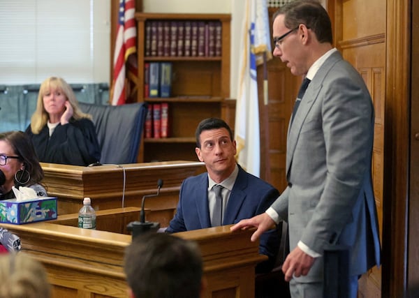 Massachusetts State Trooper, Nicholas Guarino answers questions from prosecutor Hank Brennan about text messages and voice mails on John O'Keefe's cell phone during the Karen Read trial at Norfolk Superior Court, Tuesday, May 6, 2025, in Dedham, Mass. (Matt Stone/The Boston Herald via AP, Pool)