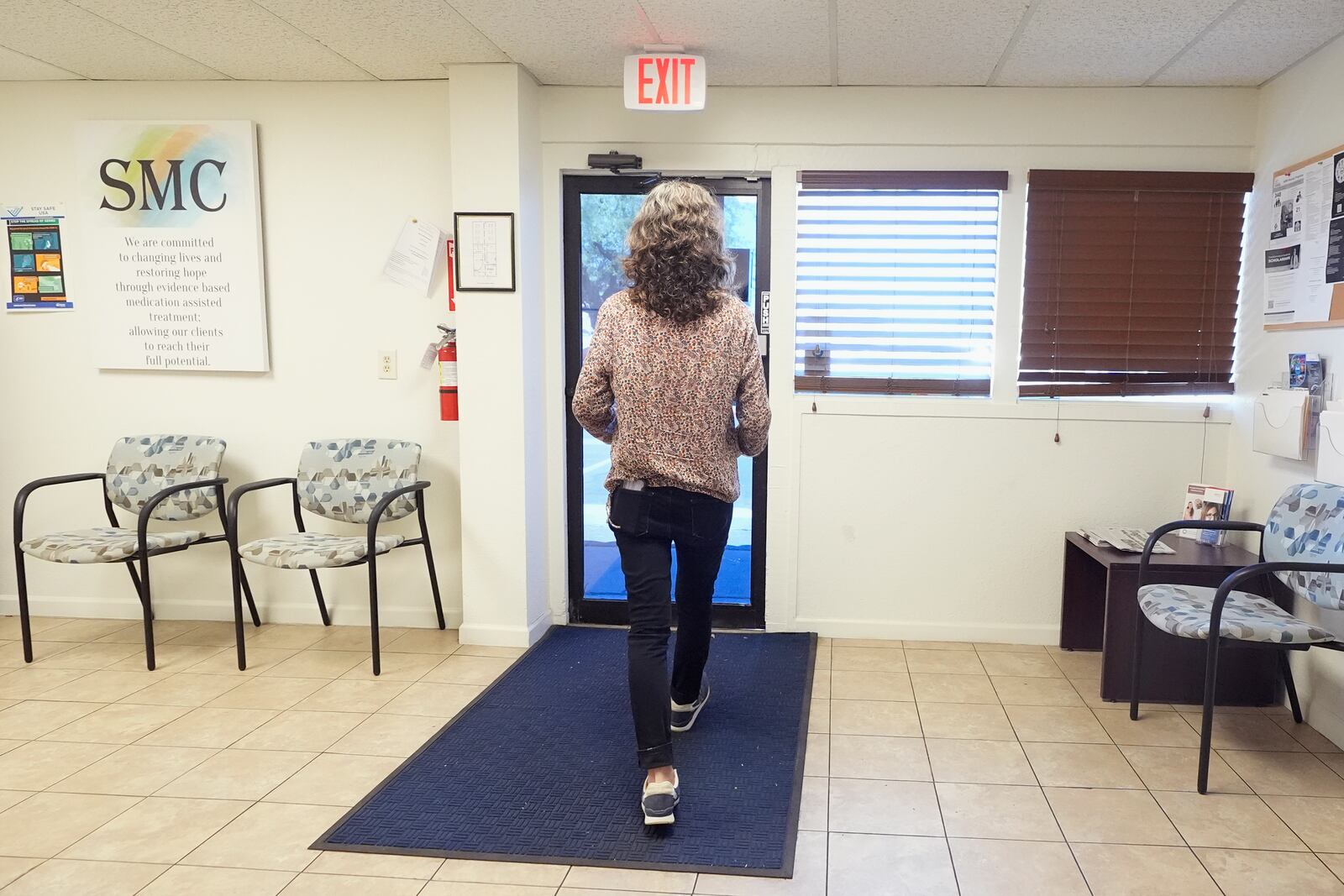 Methadone patient Irene Garnett, 44, of Phoenix, prepares to leave a clinic after taking her medication in Scottsdale, Ariz., on Monday, Aug. 26, 2024. (AP Photo/Ross D. Franklin)