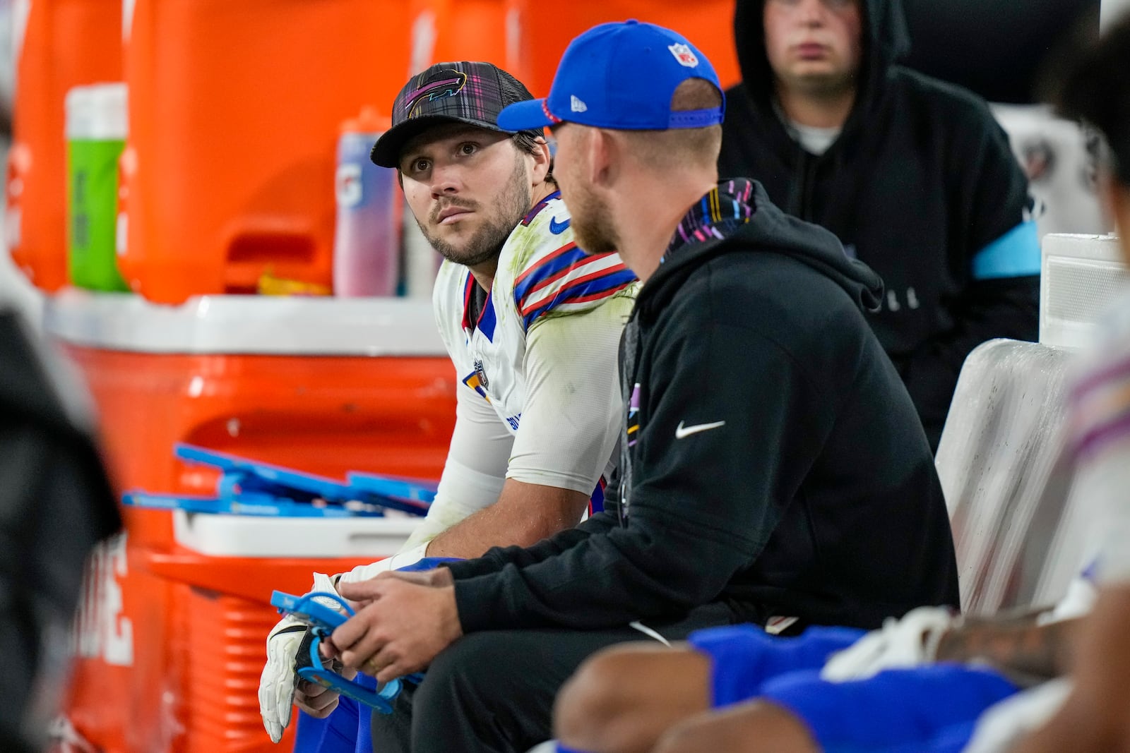 Buffalo Bills quarterback Josh Allen, left, sits on the bench after backup quarterback Mitchell Trubisky took over during the second half of an NFL football game against the Baltimore Ravens, Sunday, Sept. 29, 2024, in Baltimore. (AP Photo/Stephanie Scarbrough)