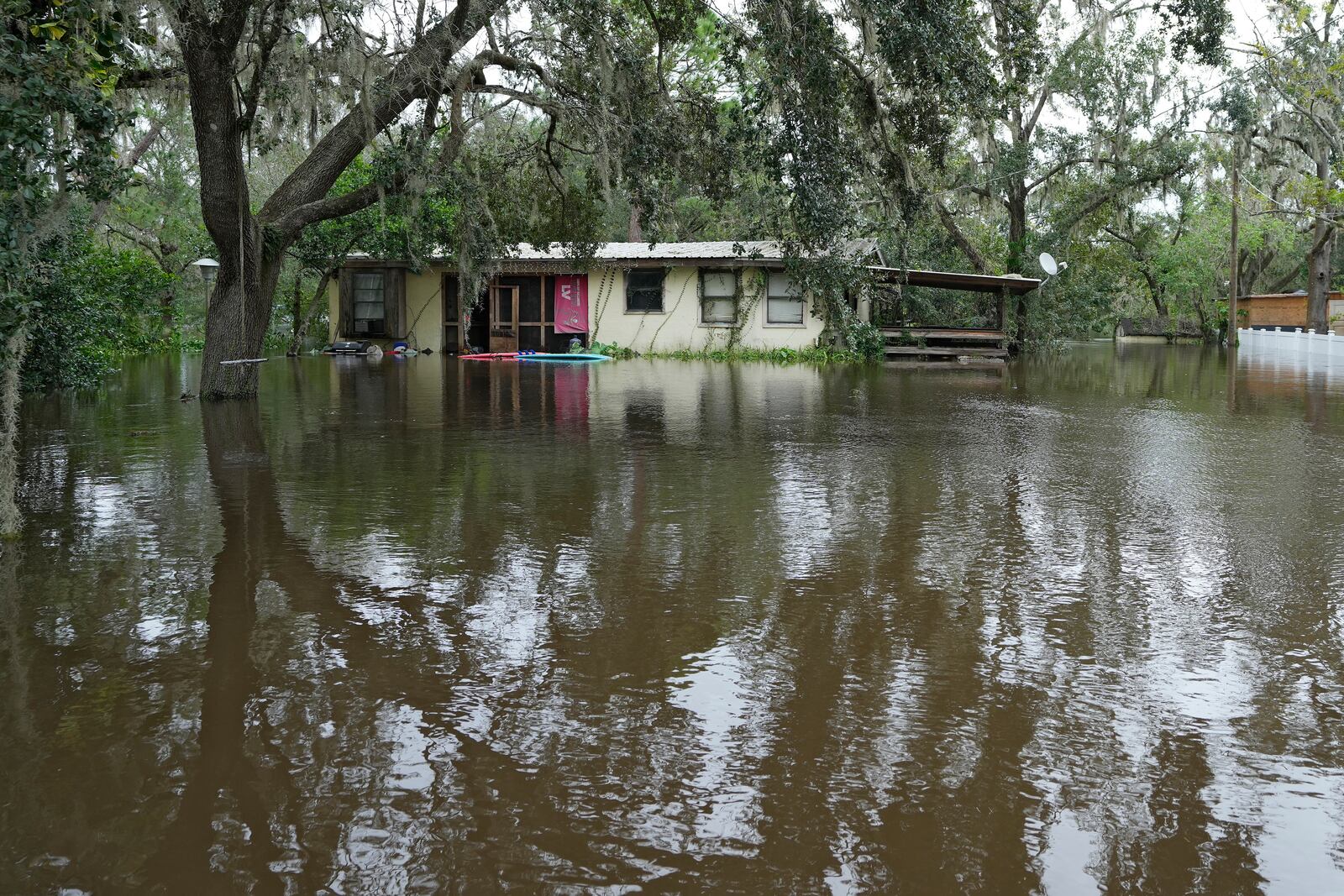 A flooded home, from the effects of Hurricane Milton is shown along the Alafia river Friday, Oct. 11, 2024, in Lithia, Fla. (AP Photo/Chris O'Meara)