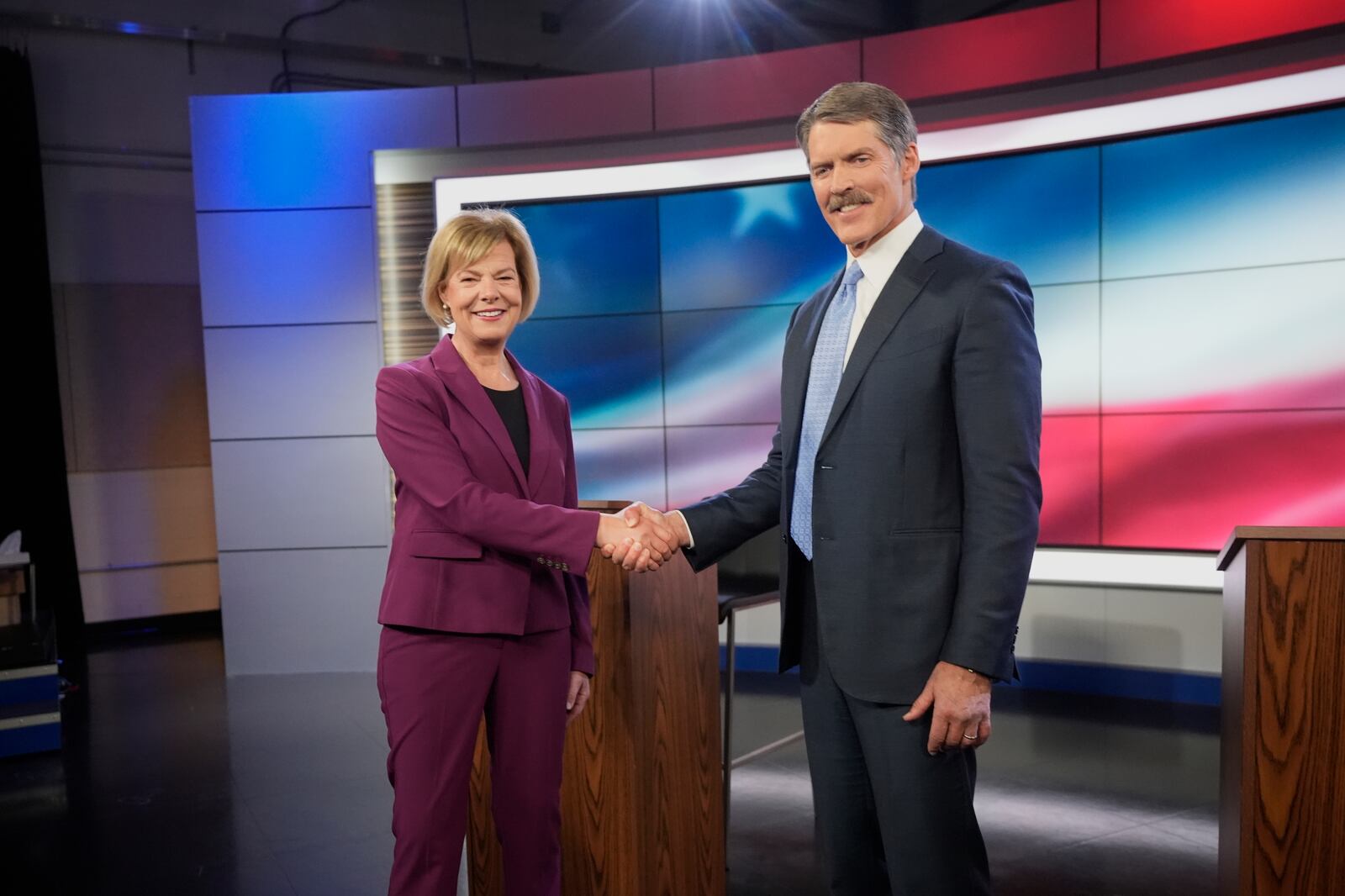 Wisconsin Senate candidates Republican Eric Hovde and Democratic U.S. Sen. Tammy Baldwin shake hands before a televised debate Friday, Oct. 18, 2024, in Madison, Wis. (AP Photo/Morry Gash)