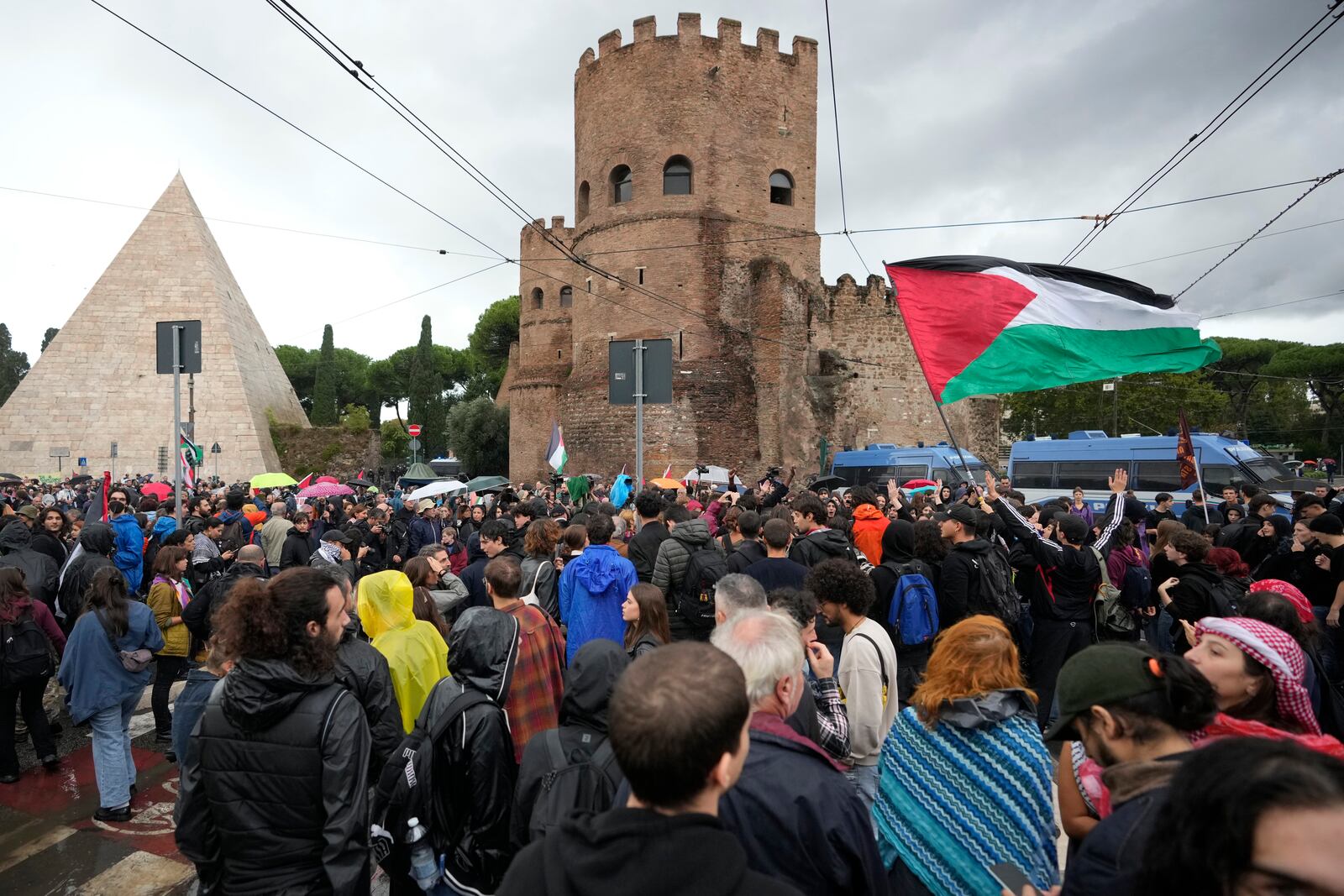 People attend at a protest in Rome, Saturday, Oct. 5, 2024. Pro-palestinians people take to the street in an unauthorised march in the centre of Rome two days ahead of the first anniversary of the Oct. 7. (AP Photo/Andrew Medichini)