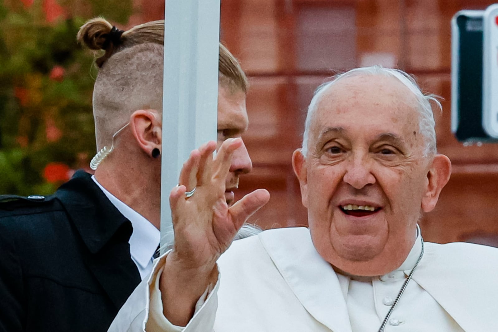 Pope Francis, flanked by security, tours Place de Metz in Luxembourg on the first day of Francis's four-day visit to Luxembourg and Belgium, Thursday, Sept. 26, 2024. (AP Photo/Geert Vanden Wijngaert)