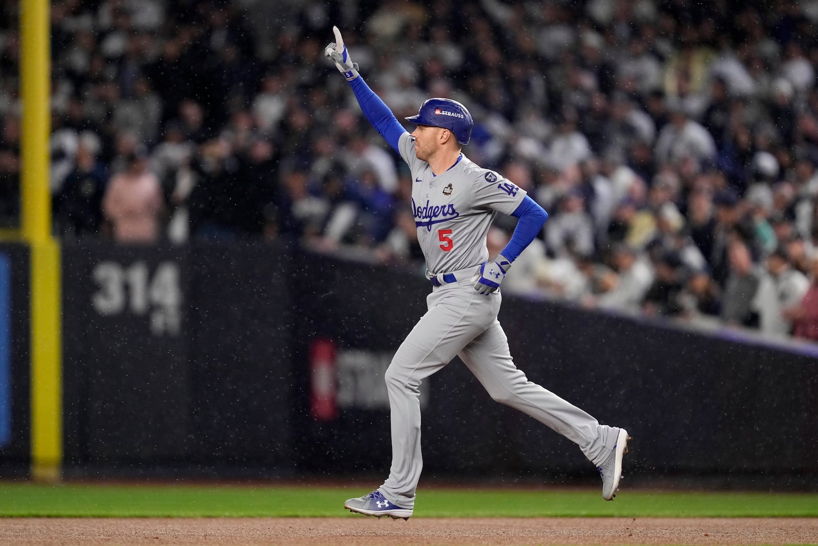 Los Angeles Dodgers' Freddie Freeman celebrates his two-run home run against the New York Yankees during the first inning in Game 4 of the baseball World Series, Tuesday, Oct. 29, 2024, in New York. (AP Photo/Ashley Landis)