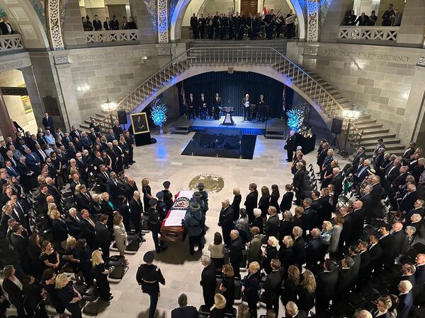 The casket of former Missouri Gov. and U.S. Sen. Christopher "Kit" Bond is brought into the Rotunda of the Missouri Capitol for a memorial service on Tuesday, May 20, 2025, in Jefferson City, Missouri. (AP Photo/David A. Lieb)