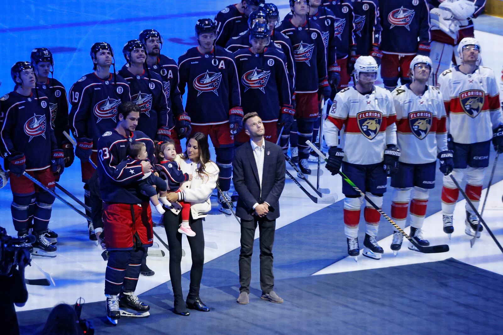 Blue Jackets' Johnny Gaudreau's family watches a #13 banner being raised during a ceremony before the start of an NHL hockey game between the Columbus Blue Jackets and the Florida Panthers. Tuesday, Oct. 15, 2024, in Columbus, Ohio. (AP Photo/Jay LaPrete)