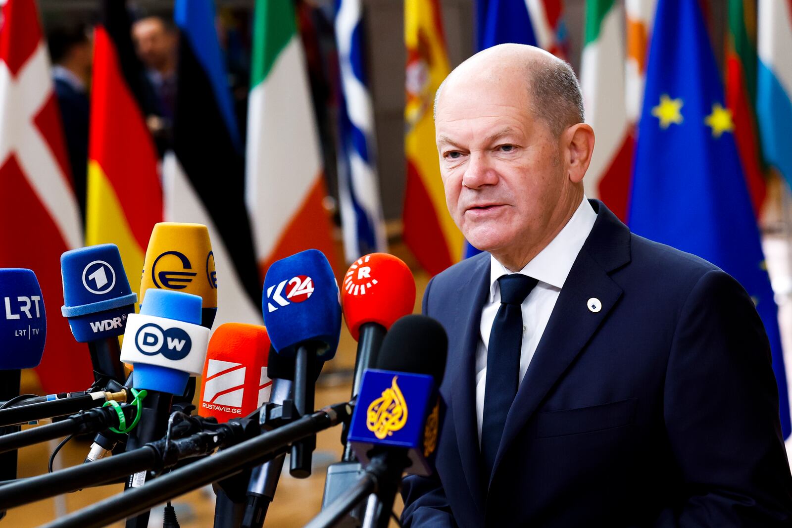 Germany's Chancellor Olaf Scholz talks to journalists as he arrives to an EU summit in Brussels, Thursday, Oct. 17, 2024. (AP Photo/Geert Vanden Wijngaert)