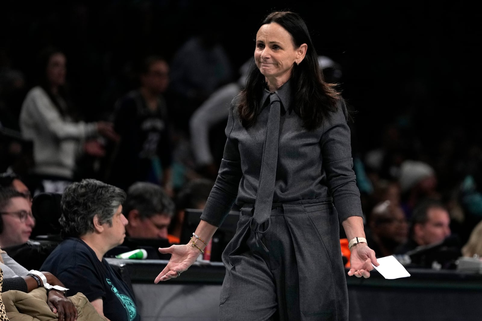 New York Liberty head coach Sandy Brondello stands on the court during the second half in Game 1 of a WNBA basketball final playoff series against the Minnesota Lynx, Thursday, Oct. 10, 2024, in New York. (AP Photo/Pamela Smith)