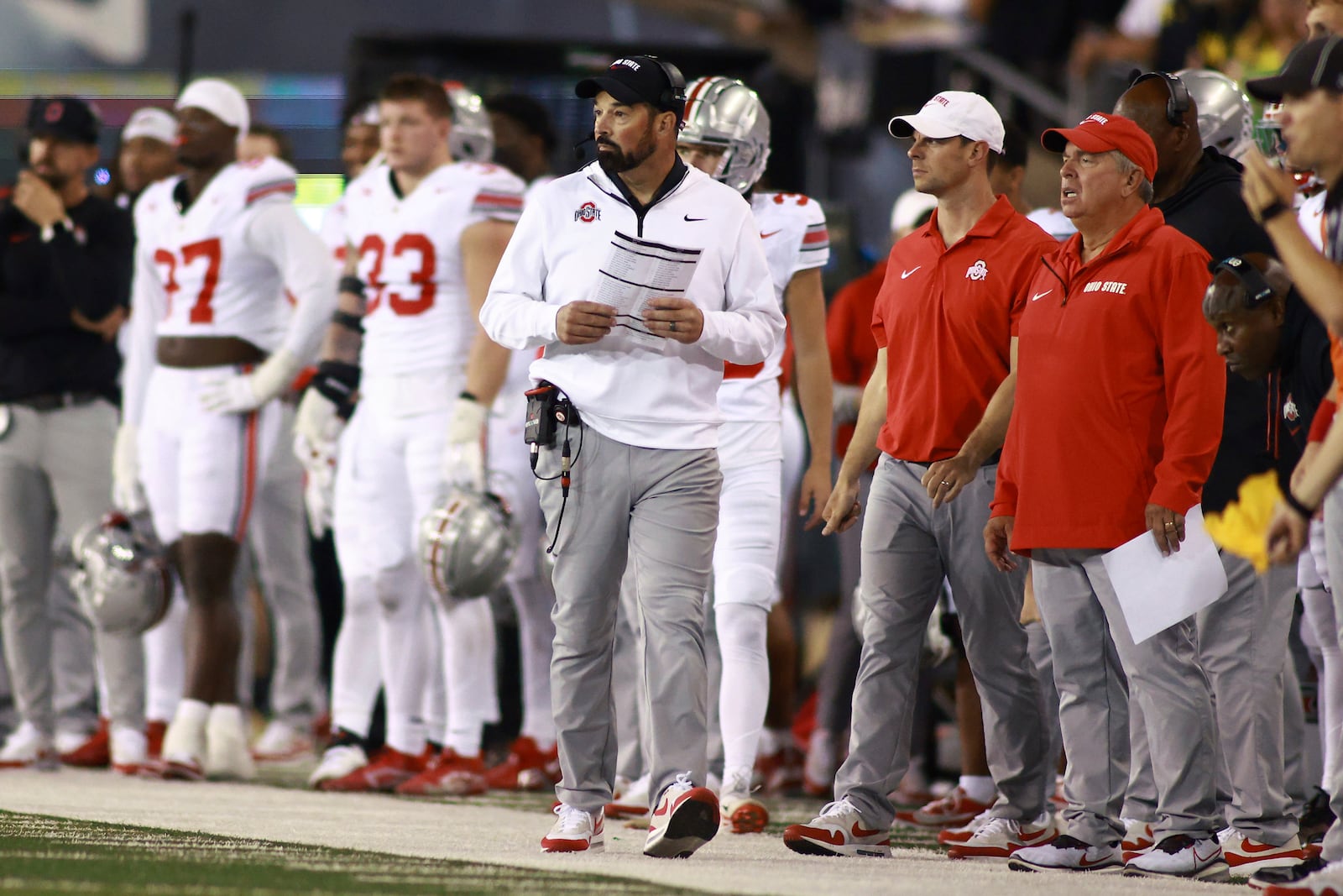 Ohio State head coach Ryan Day, center, watches an NCAA college football game against Oregon, Saturday, Oct. 12, 2024, in Eugene, Ore. (AP Photo/Lydia Ely)