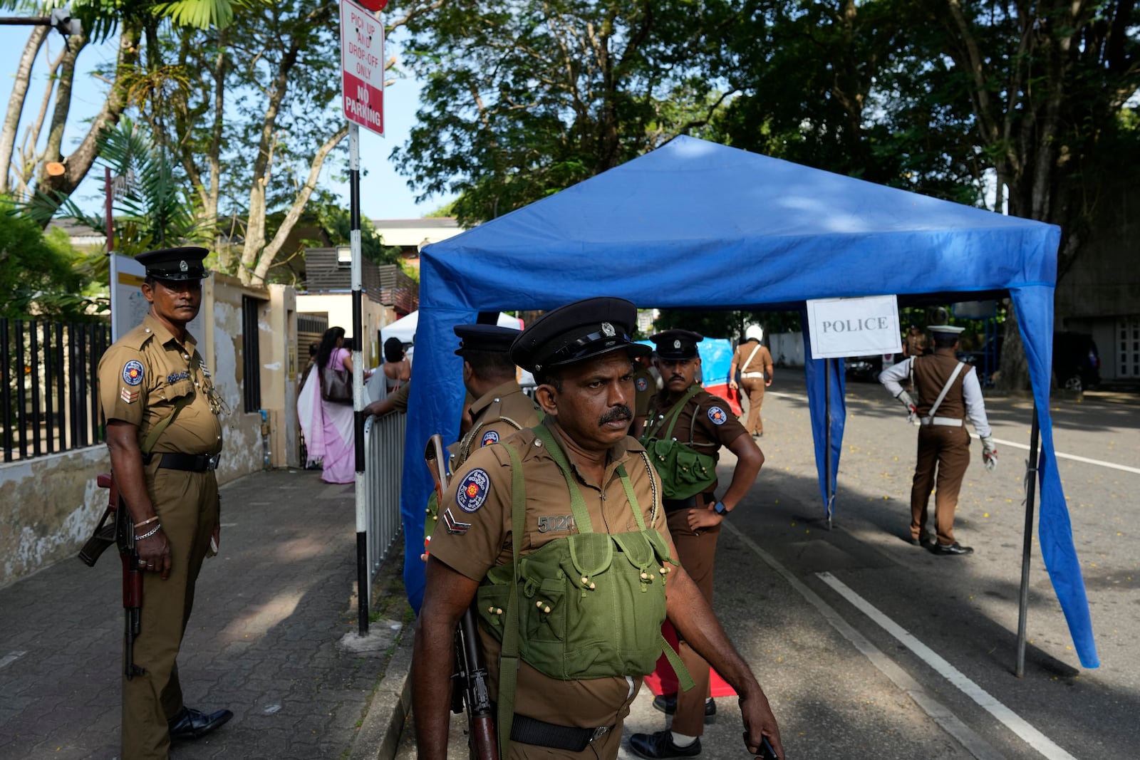 Police officers wait for transport to travel to polling stations ahead of the upcoming presidential election, in Colombo, Sri Lanka, Friday, Sept. 20, 2024. (AP Photo/Eranga Jayawardena)