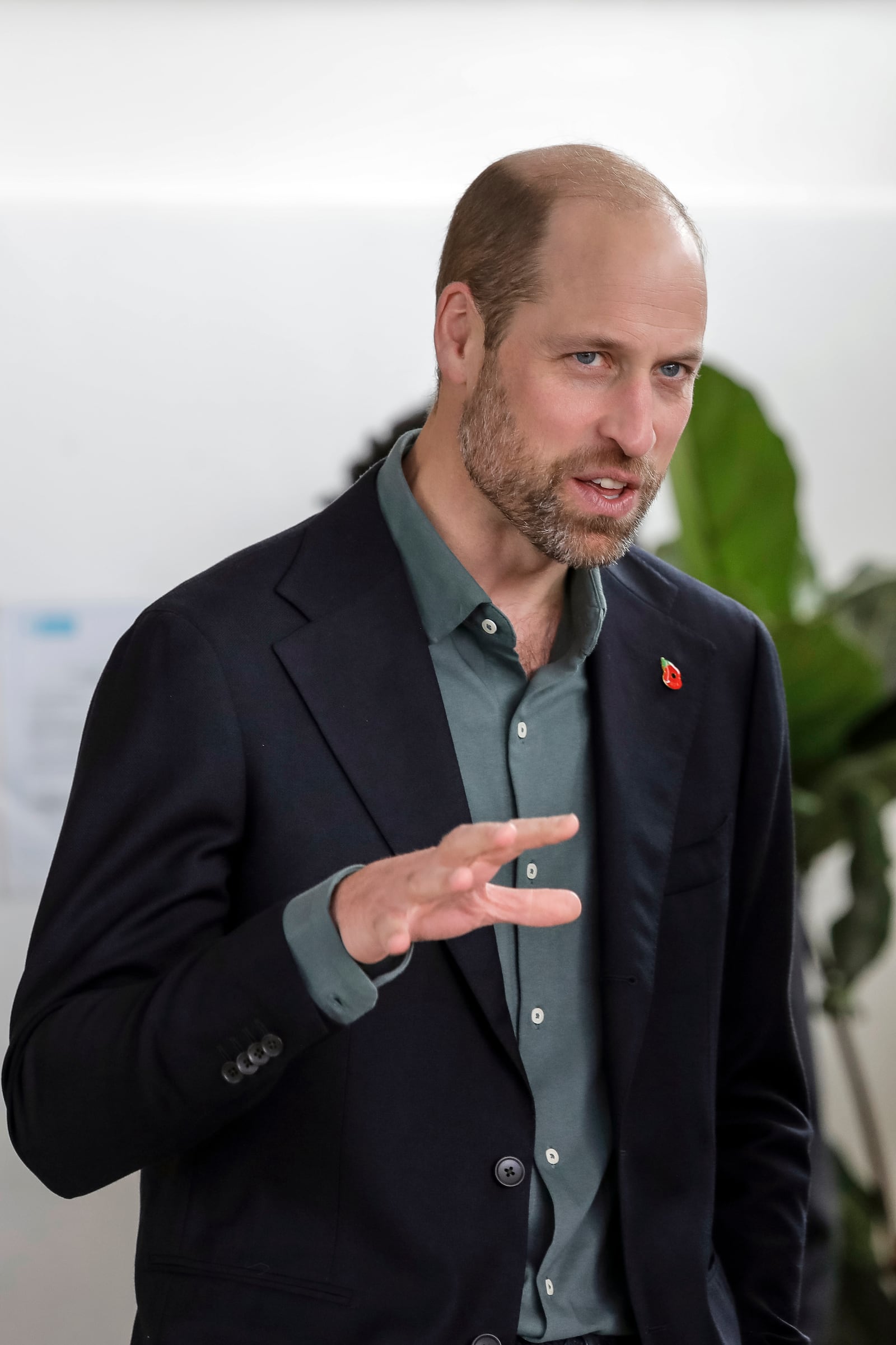 Britain's Prince William speaks to an attendee at the Earthshot Prize Climate Leaders Youth Programme at Rooftop on Bree in Cape Town, South Africa, Monday Nov. 4, 2024. (Gianluigi Guercia/Pool Photo via AP)