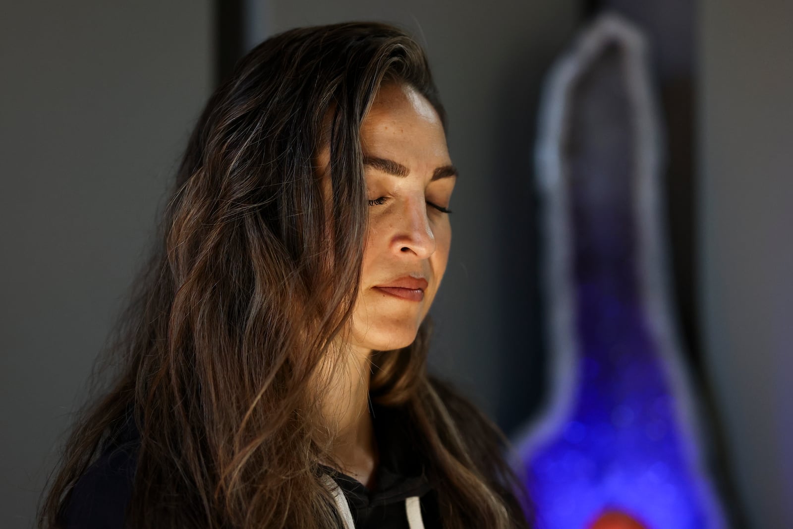 Headspace meditation teacher, Rosie Acosta, meditates in her studio Monday, Sept. 30, 2024, in Woodland Hills, Calif. (AP Photo/Jessie Alcheh)