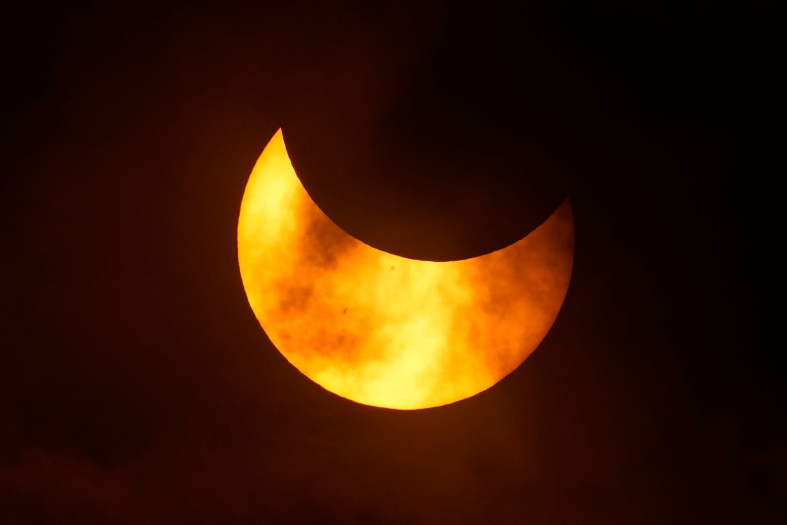 FILE - The moon moves in front of the sun during an annular solar eclipse, or ring of fire, Saturday, Oct. 14, 2023, as seen from San Antonio. (AP Photo/Eric Gay, File)