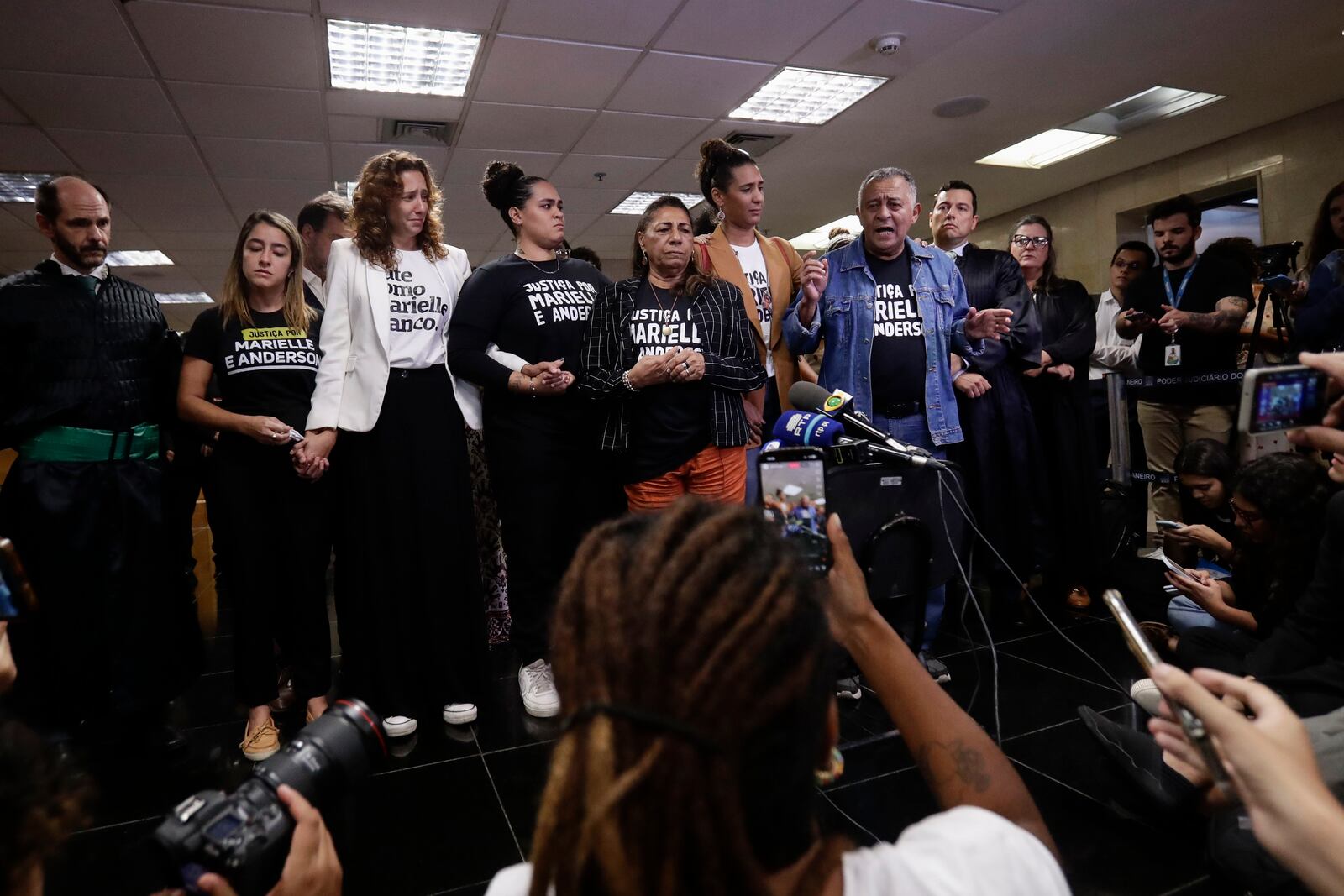 Family members of slain councilwoman Marielle Franco address the press after a judge sentenced two former police officers for the 2018 murder of Franco and her driver Anderson Gomes, at the Court of Justice in Rio de Janeiro, Thursday, Oct. 31, 2024. (AP Photo/Bruna Prado)