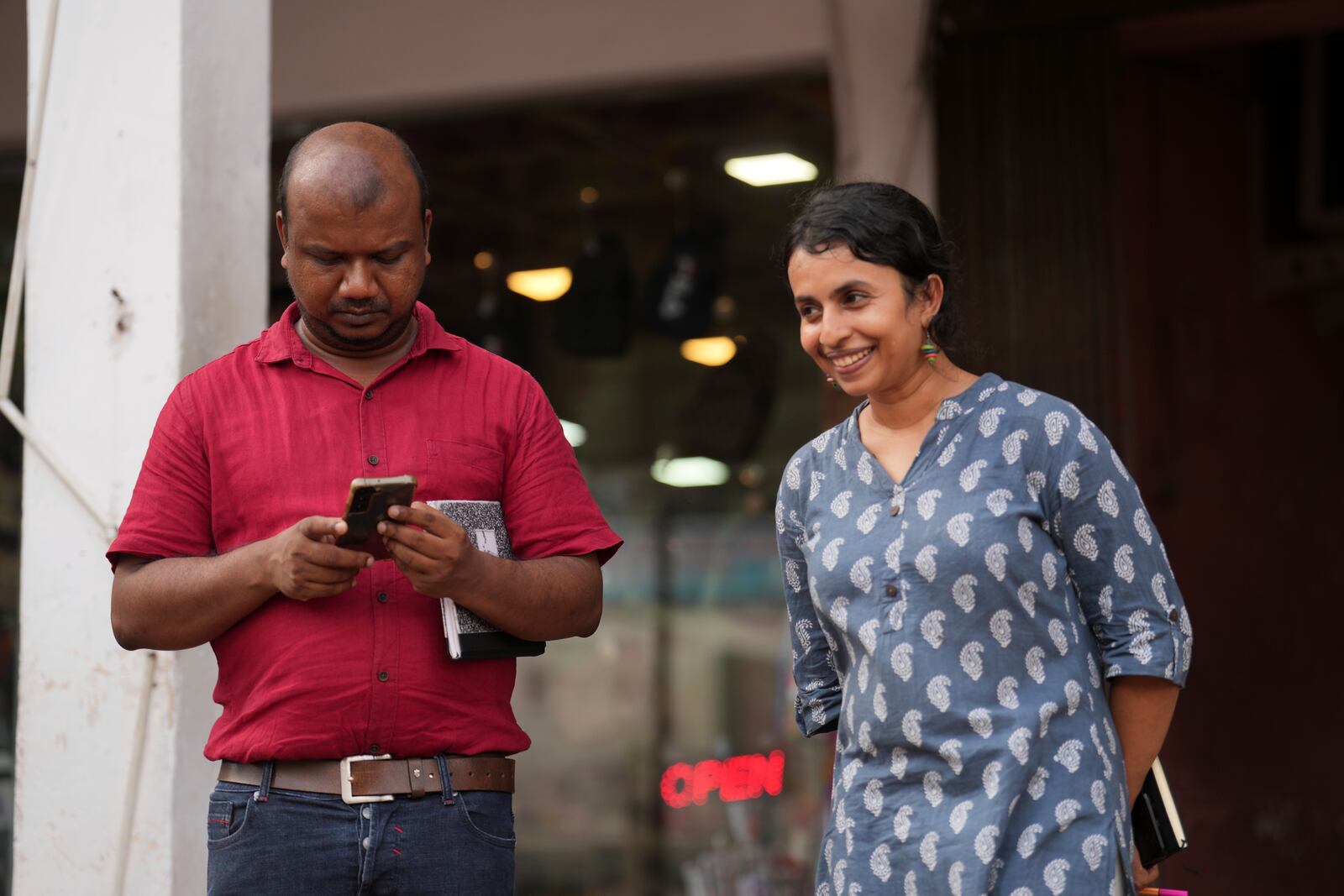 Swasthika Arulingam, right, 37, a human rights lawyer and a minority Tamil, who offered legal aid to protesters during the uprising, talks to Nuwan Bopage, a presidential candidate from People's Struggle Alliance during an election campaign in Colombo, Sri Lanka, Monday, Sept. 16, 2024. (AP Photo/Rajesh Kumar Singh)