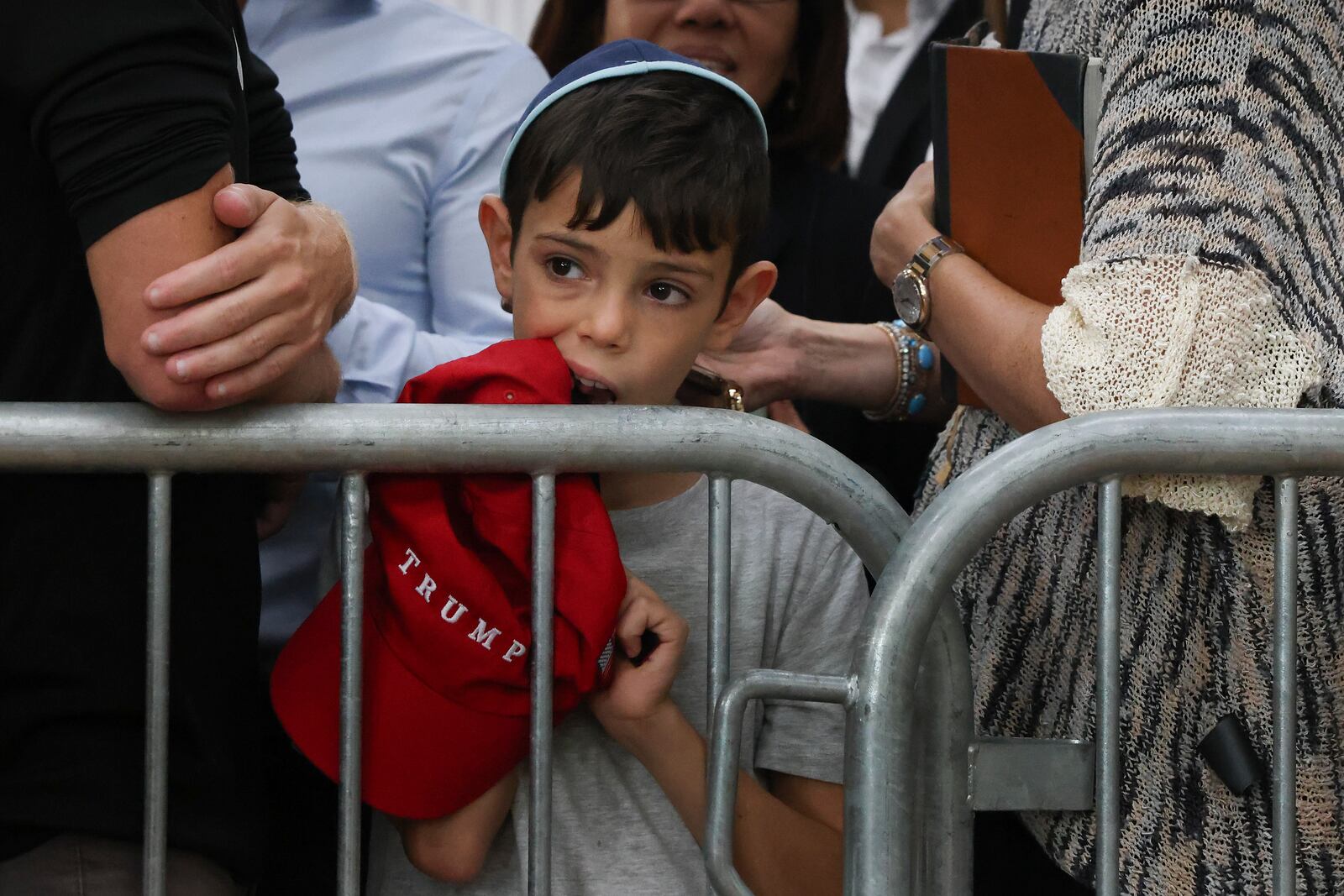 A boy awaits the arrival of Republican presidential nominee former President Donald Trump at Ohel Chabad-Lubavitch, Monday, Oct. 7, 2024, in New York. (AP Photo/Yuki Iwamura)