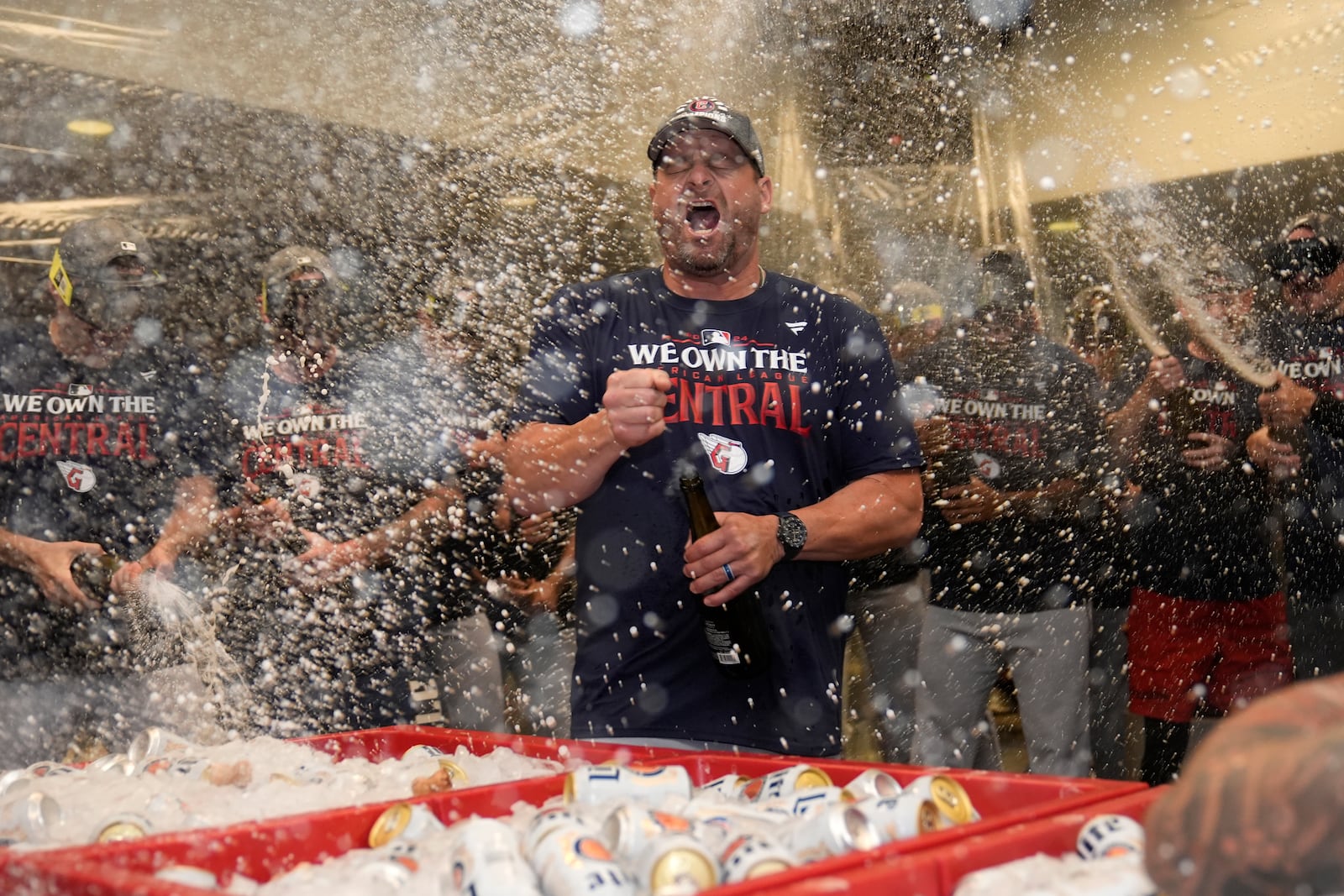 Cleveland Guardians manager Stephen Vogt celebrates in the clubhouse following a baseball game against the St. Louis Cardinals and winning the American League Central Saturday, Sept. 21, 2024, in St. Louis. (AP Photo/Jeff Roberson)