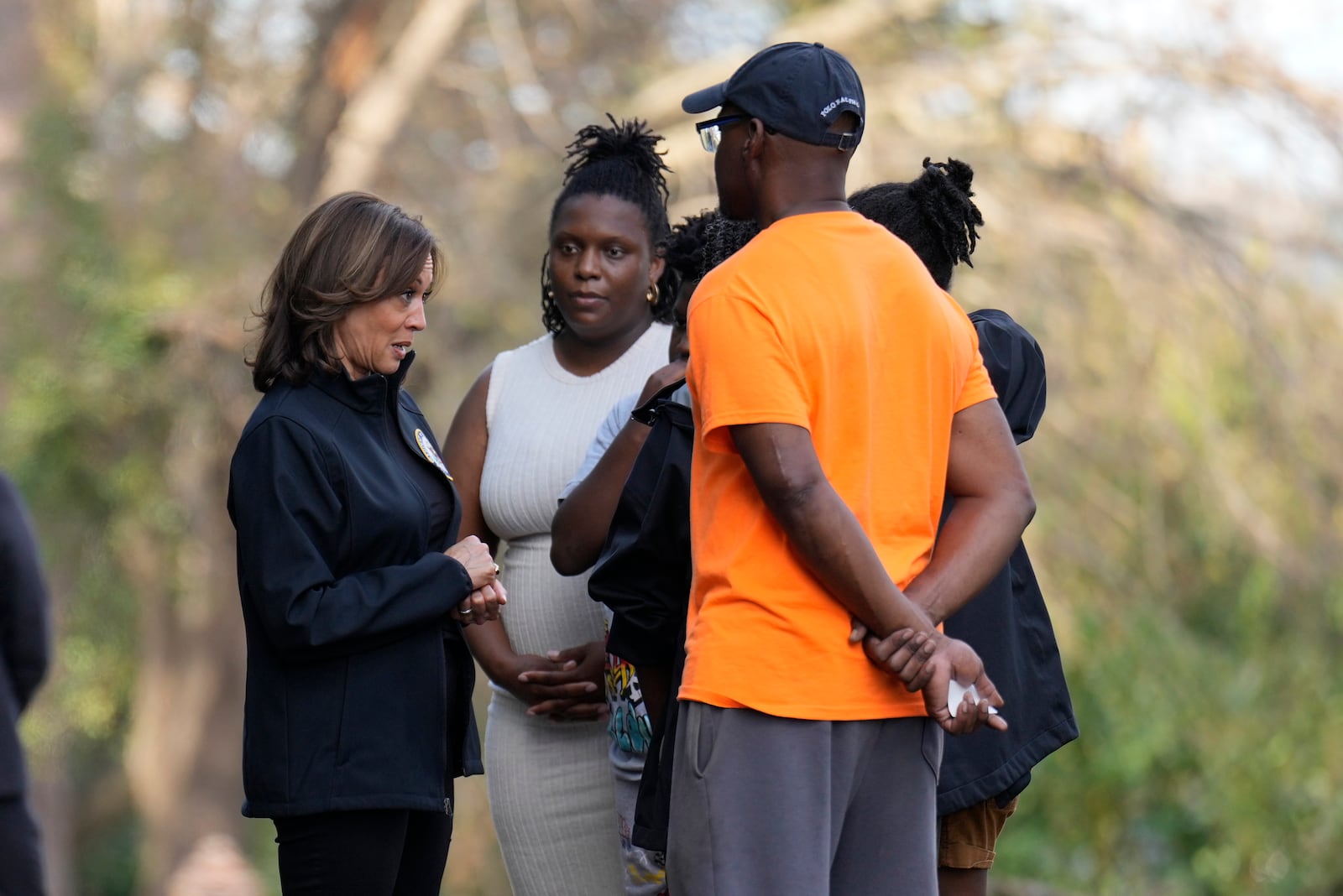 Democratic presidential nominee Vice President Kamala Harris talks with people impacted by Hurricane Helene in Augusta, Ga., Wednesday, Oct. 2, 2024. (AP Photo/Carolyn Kaster)