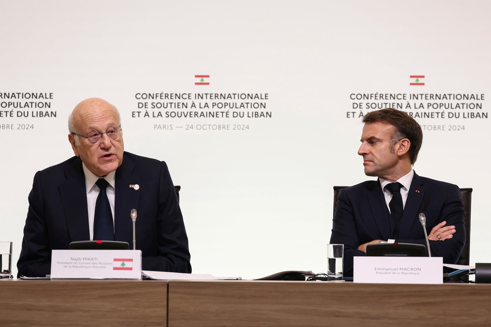 France's President Emmanuel Macron listens to Lebanon's Prime Minister caretaker Prime Minister Najib Mikati, left, during international conference for Lebanon in Paris, Thursday, Oct.24, 2024. (Alain Jocard, Pool via AP)