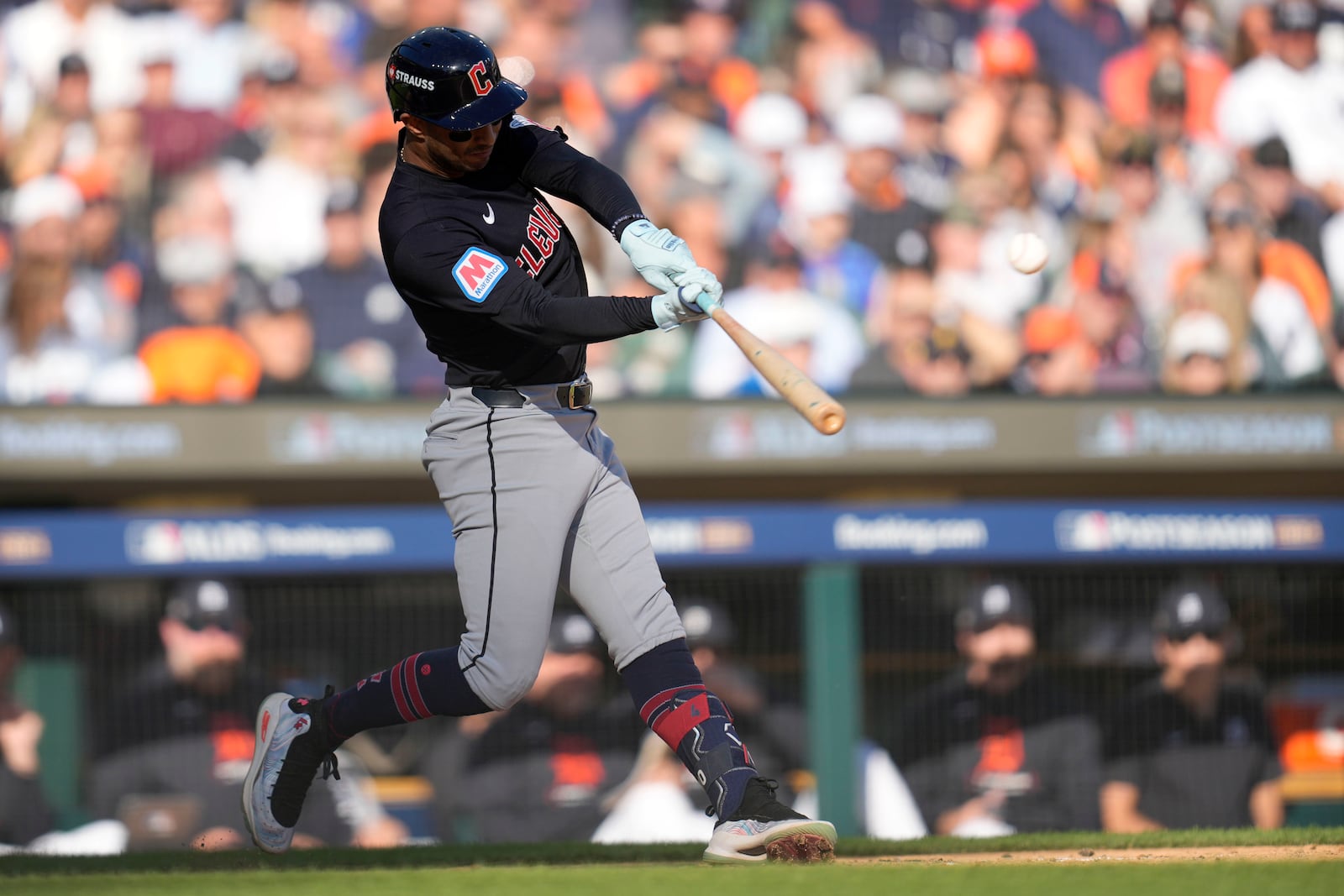 Cleveland Guardians' Brayan Rocchio hits a single in the fifth inning during Game 3 of a baseball American League Division Series against the Detroit Tigers, Wednesday, Oct. 9, 2024, in Detroit. (AP Photo/Paul Sancya)