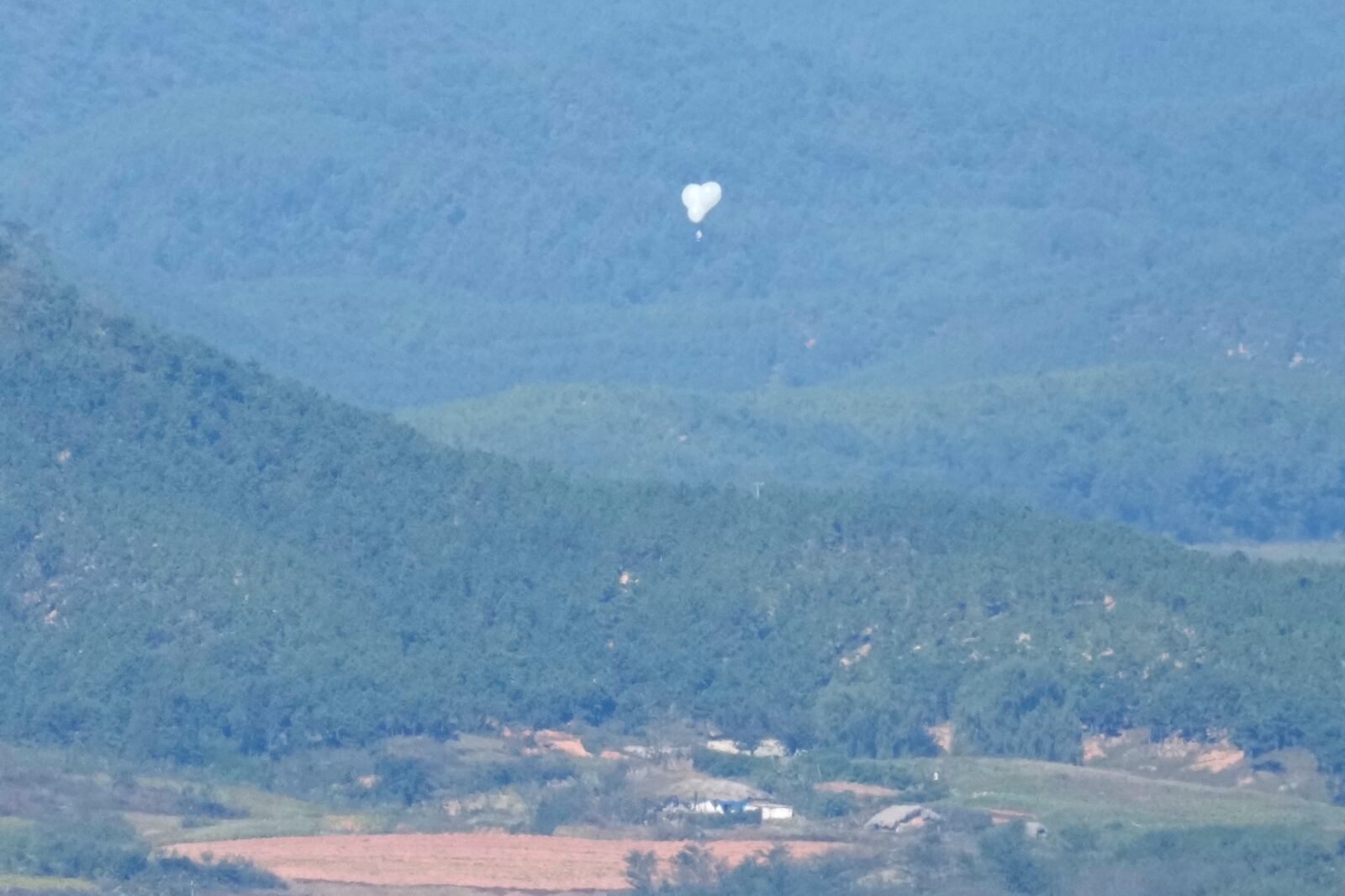 FILE - North Korean balloons are seen from the Unification Observation Post in Paju, South Korea, near the border with North Korea, Friday, Oct. 4, 2024. (AP Photo/Lee Jin-man, File)