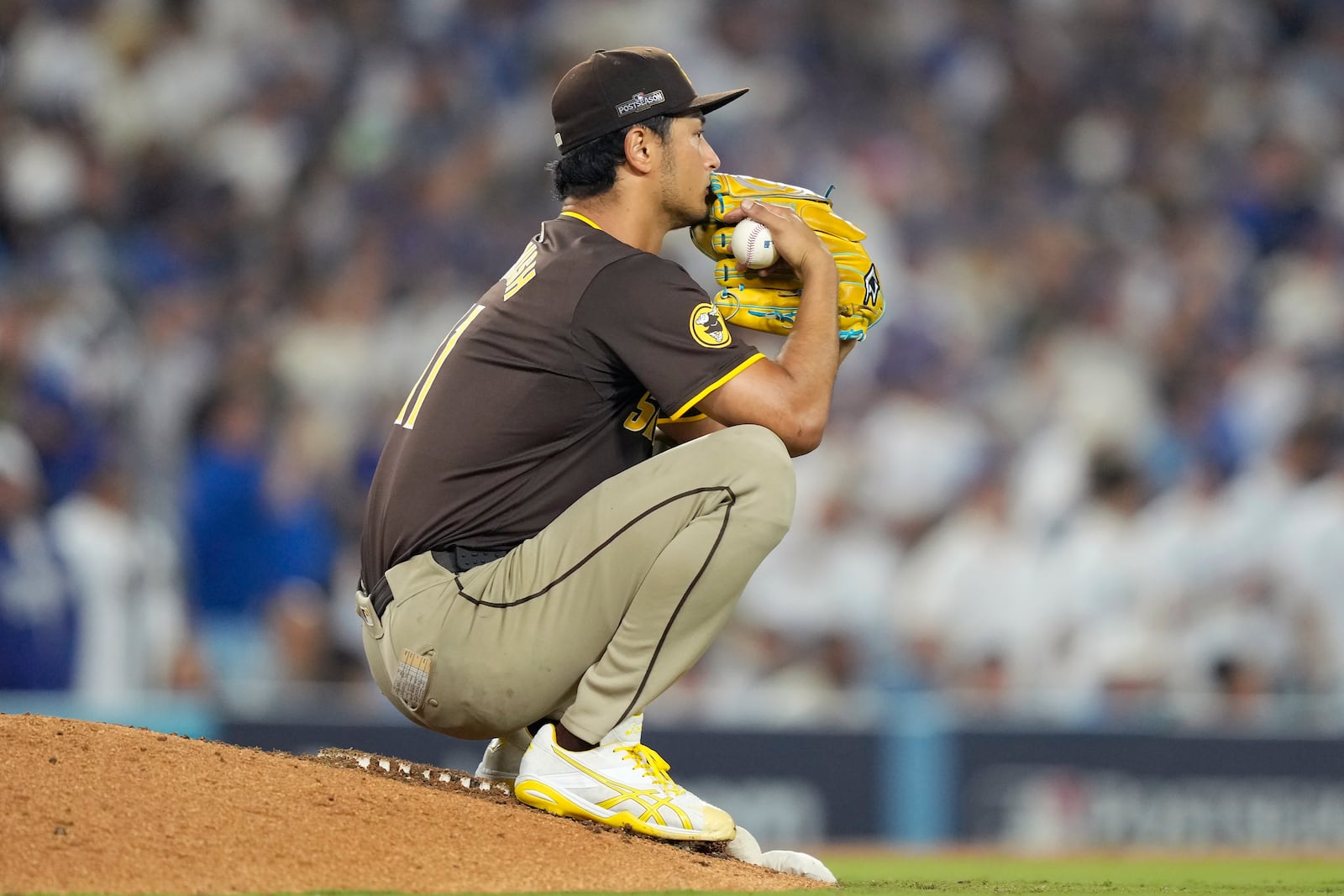 San Diego Padres pitcher Yu Darvish pauses on the mound during the seventh inning in Game 2 of a baseball NL Division Series against the Los Angeles Dodgers, Sunday, Oct. 6, 2024, in Los Angeles. (AP Photo/Mark J. Terrill)