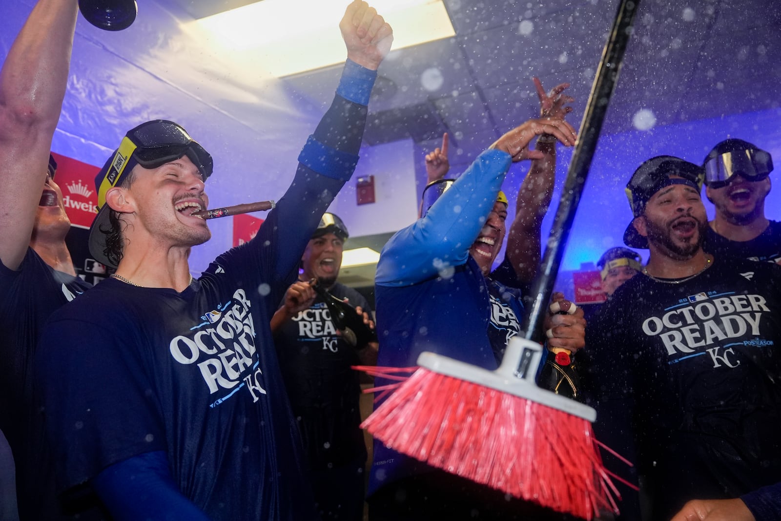 Kansas City Royals shortstop Bobby Witt Jr., left, catcher Salvador Perez, center, and outfielder Tommy Pham, right, celebrate with teammates after defeating the Baltimore Orioles 2-1 in Game 2 of an AL Wild Card Series baseball game, Wednesday, Oct. 2, 2024 in Baltimore. (AP Photo/Stephanie Scarbrough)