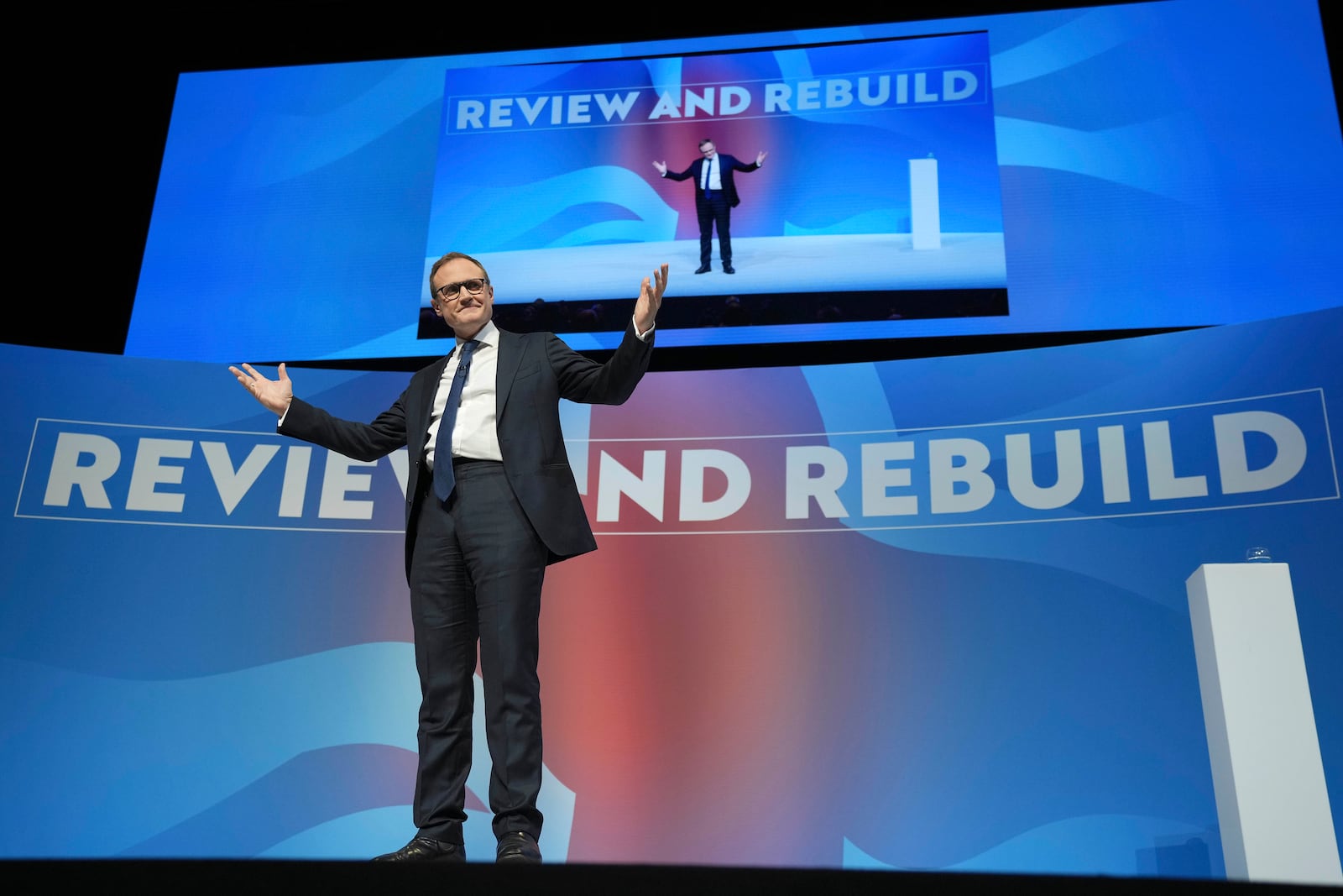 Conservative leadership candidate Tom Tugendhat gestures to members during the Conservative Party Conference at the International Convention Centre in Birmingham, England, Wednesday, Oct. 2, 2024.(AP Photo/Kin Cheung)