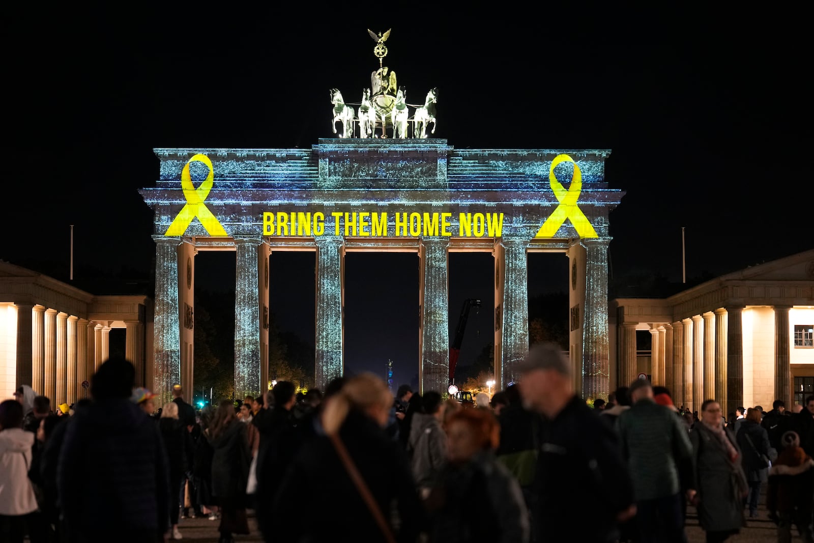 The Brandenburg Gate is illuminated in solidarity with Israel, marking the first anniversary of the Hamas spearheaded attacks on Israel, in Berlin, Germany, Monday, Oct. 7, 2024. (AP Photo/Markus Schreiber)