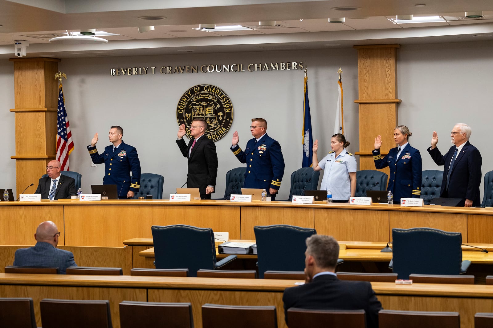 Coast Guard members of the investigative board for the Titan marine board formal hearing take an oath inside the Charleston County Council Chambers Monday, Sept. 16, 2024, in North Charleston, S.C. (AP Photo/Mic Smith)