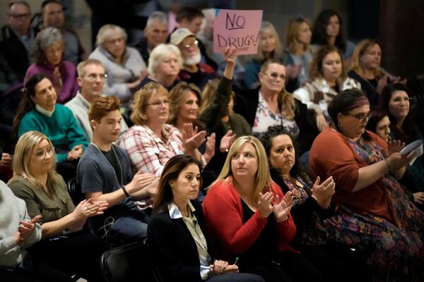 FILE - People applaud during a rally in favor of legislation banning gender-affirming healthcare for minors, Monday, March 20, 2023, at the Missouri Statehouse in Jefferson City, Mo. (AP Photo/Charlie Riedel, File)