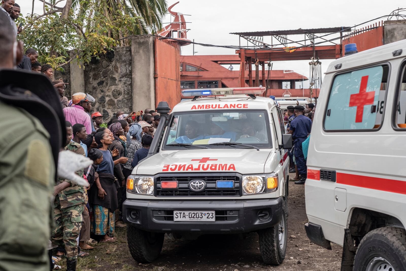 An ambulance carries victims away from the port of Goma, Democratic Republic of Congo, after a ferry carrying hundreds capsized on arrival Thursday, Oct. 3, 2024. (AP Photo/Moses Sawasawa)