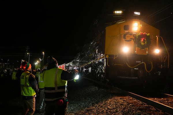 The CSX Holiday Express arrives, in Erwin, Tenn. Thursday, Nov. 21, 2024. The railway company held a celebration and concert for the town affected by Hurricane Helene. (AP Photo/George Walker IV)