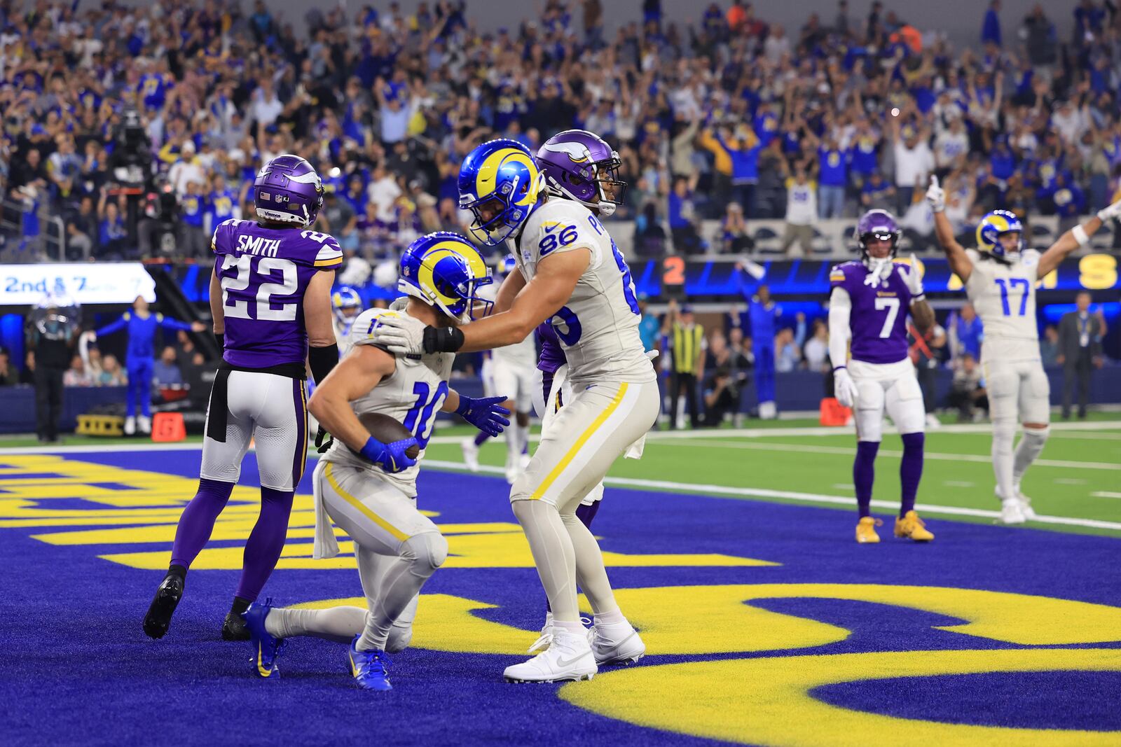 Los Angeles Rams wide receiver Cooper Kupp (10) celebrates with tight end Colby Parkinson (86) after catching a 7-yard touchdown pass during the first half of an NFL football game against the Minnesota Vikings, Thursday, Oct. 24, 2024, in Inglewood, Calif. (AP Photo/Ryan Sun)