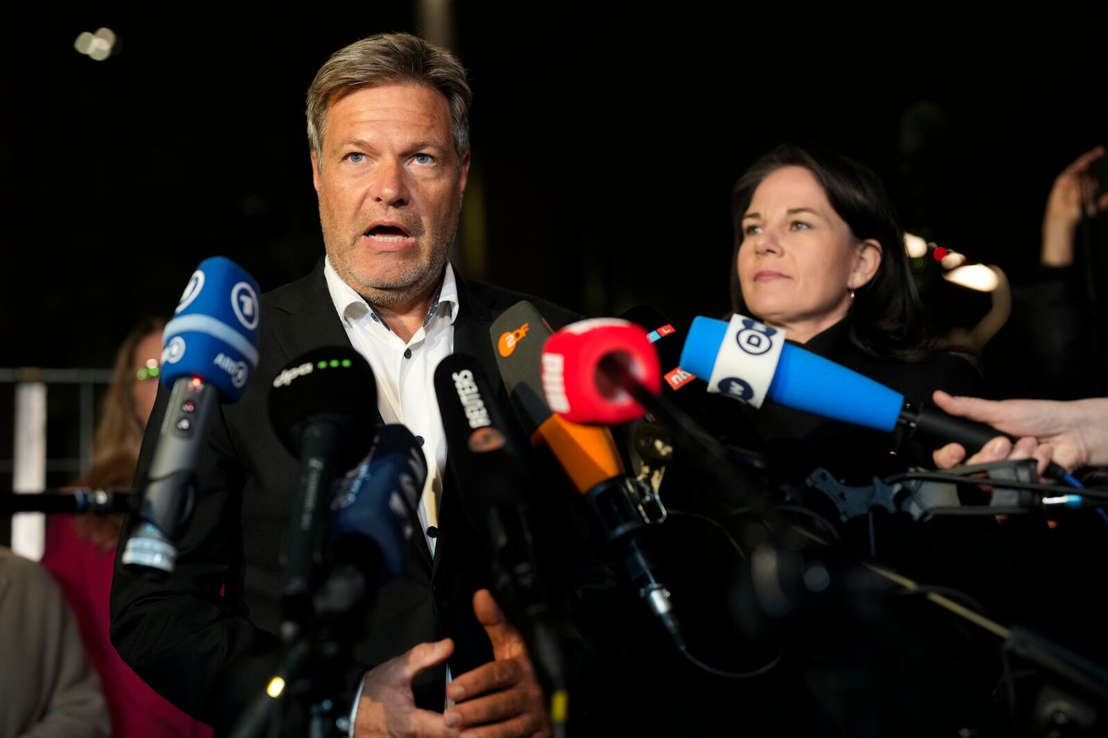 German Vice Chancellor and Economy and Climate Minister Robert Habeck, left, Foreign Minister Annalena Baerbocka brief the media after a meeting of German government leaders at the chancellery in Berlin, Germany, Wednesday, Nov. 6, 2024. (AP Photo/Markus Schreiber)