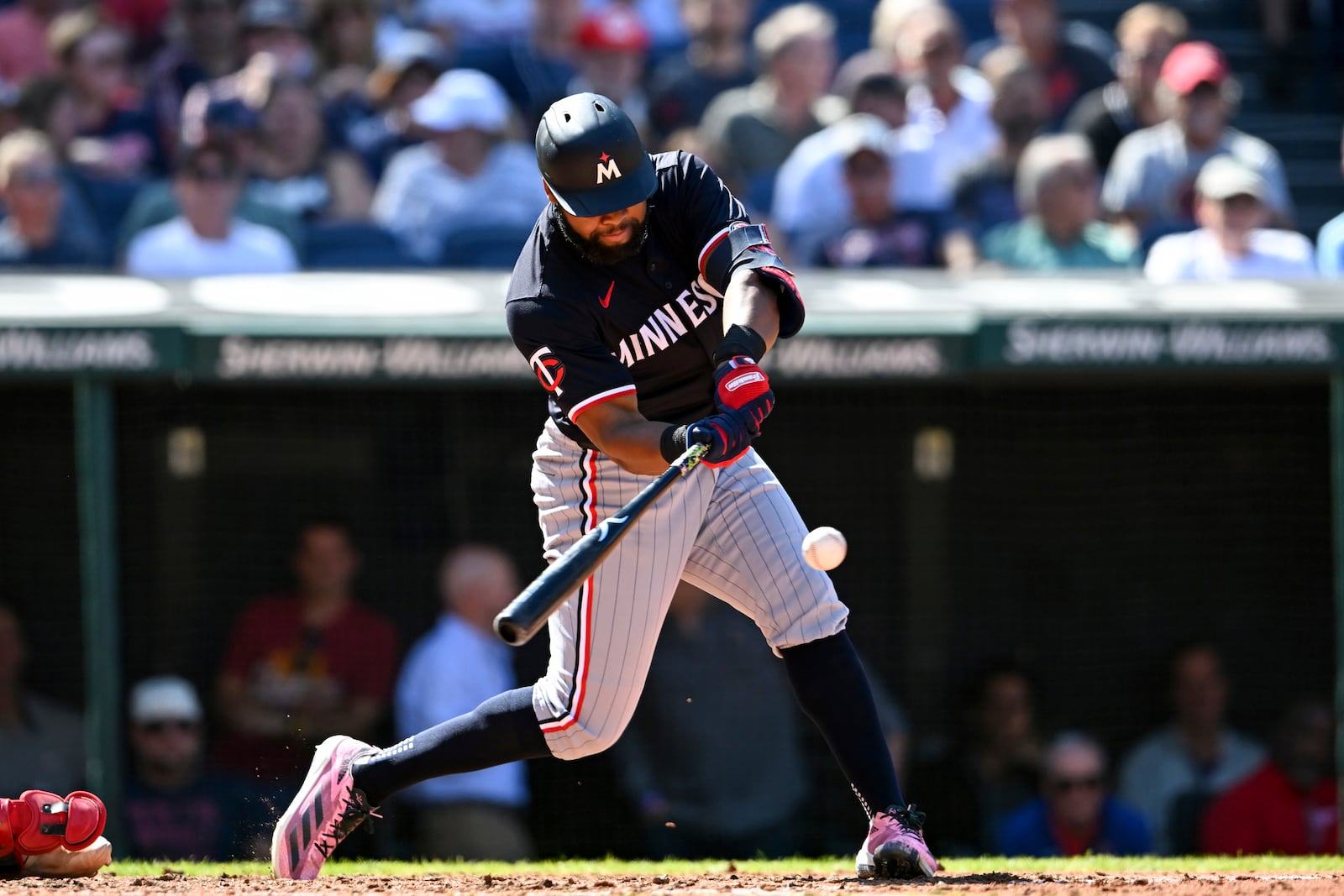 Minnesota Twins' Manuel Margot hits a two-run double during the fifth inning of a baseball game against the Cleveland Guardians, Thursday, Sept. 19, 2024, in Cleveland. (AP Photo/Nick Cammett)