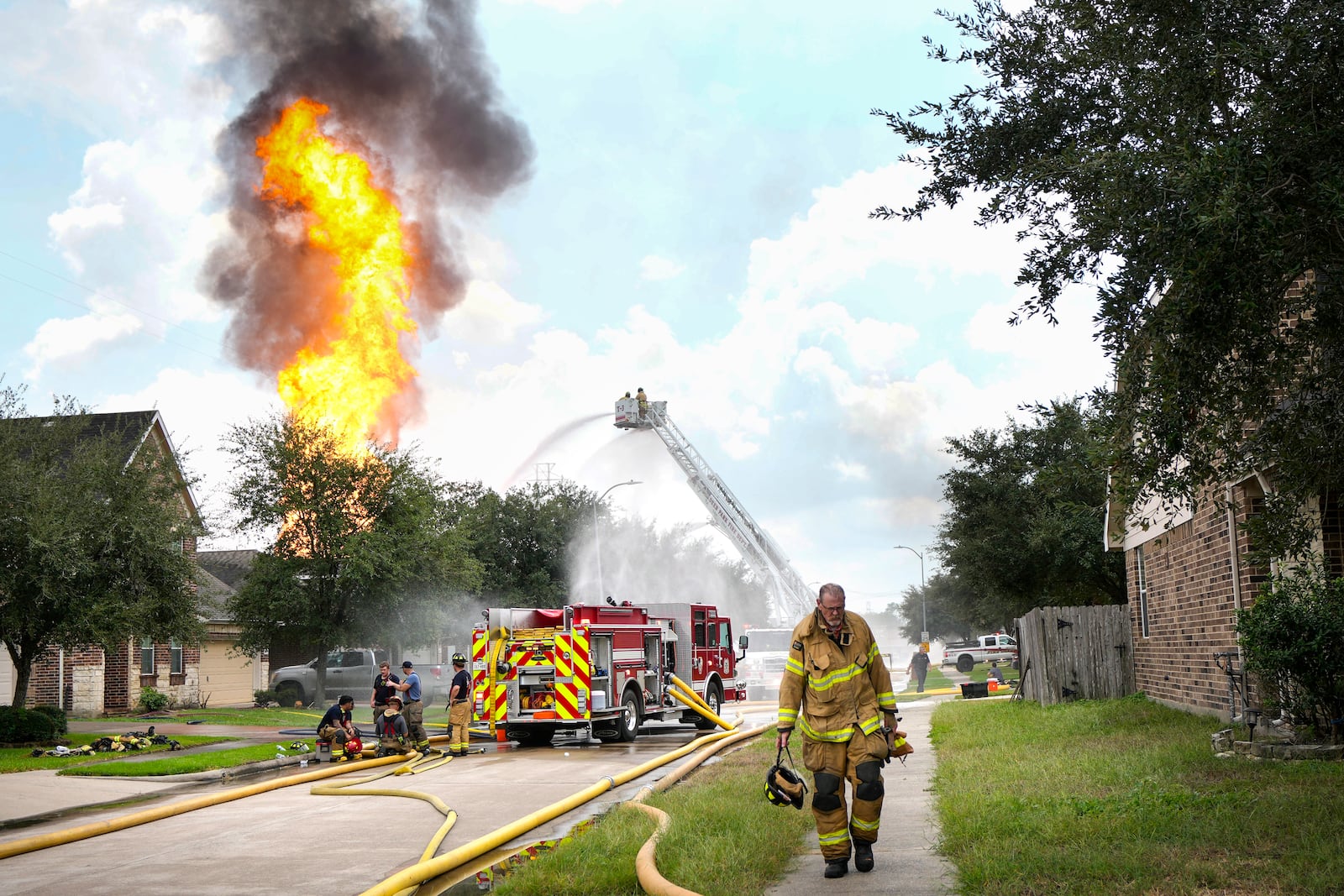 Firefighters battle a blaze from a pipeline carrying liquified natural gas that burns near Spencer Highway and Summerton on Monday, Sept. 16, 2024, in La Porte, Texas. (Brett Coomer/Houston Chronicle via AP)